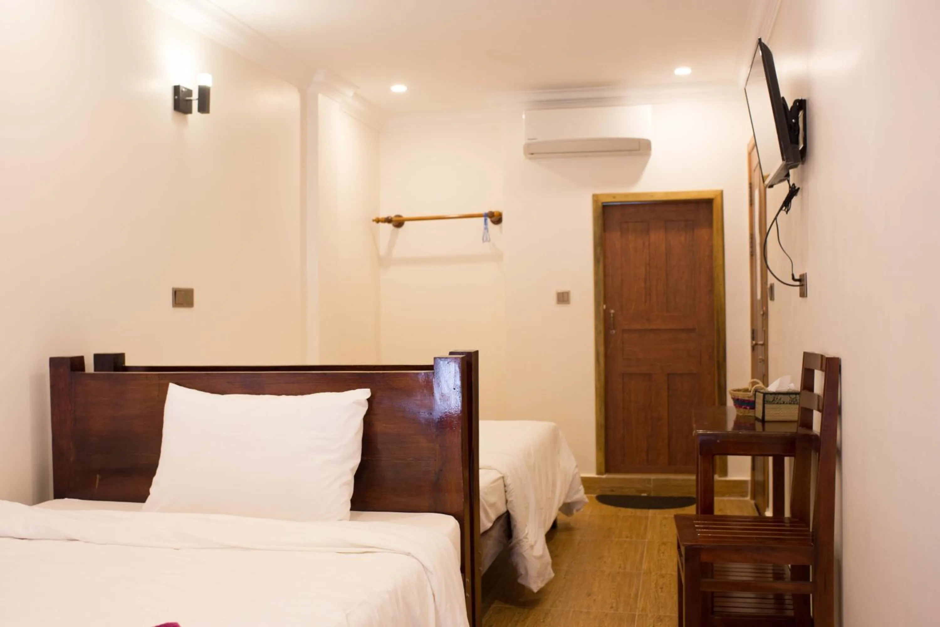 Bed in TWIN HOME Guesthouse