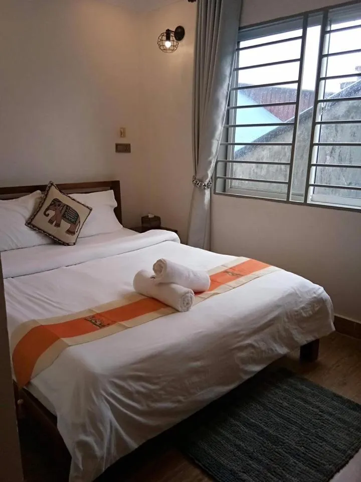 Bed in TWIN HOME Guesthouse