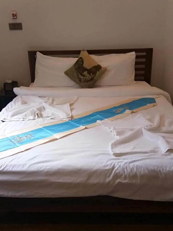 Bed in TWIN HOME Guesthouse