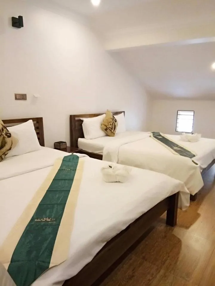 Bed in TWIN HOME Guesthouse