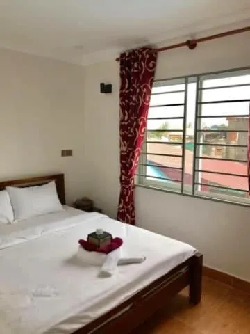 Bed in TWIN HOME Guesthouse