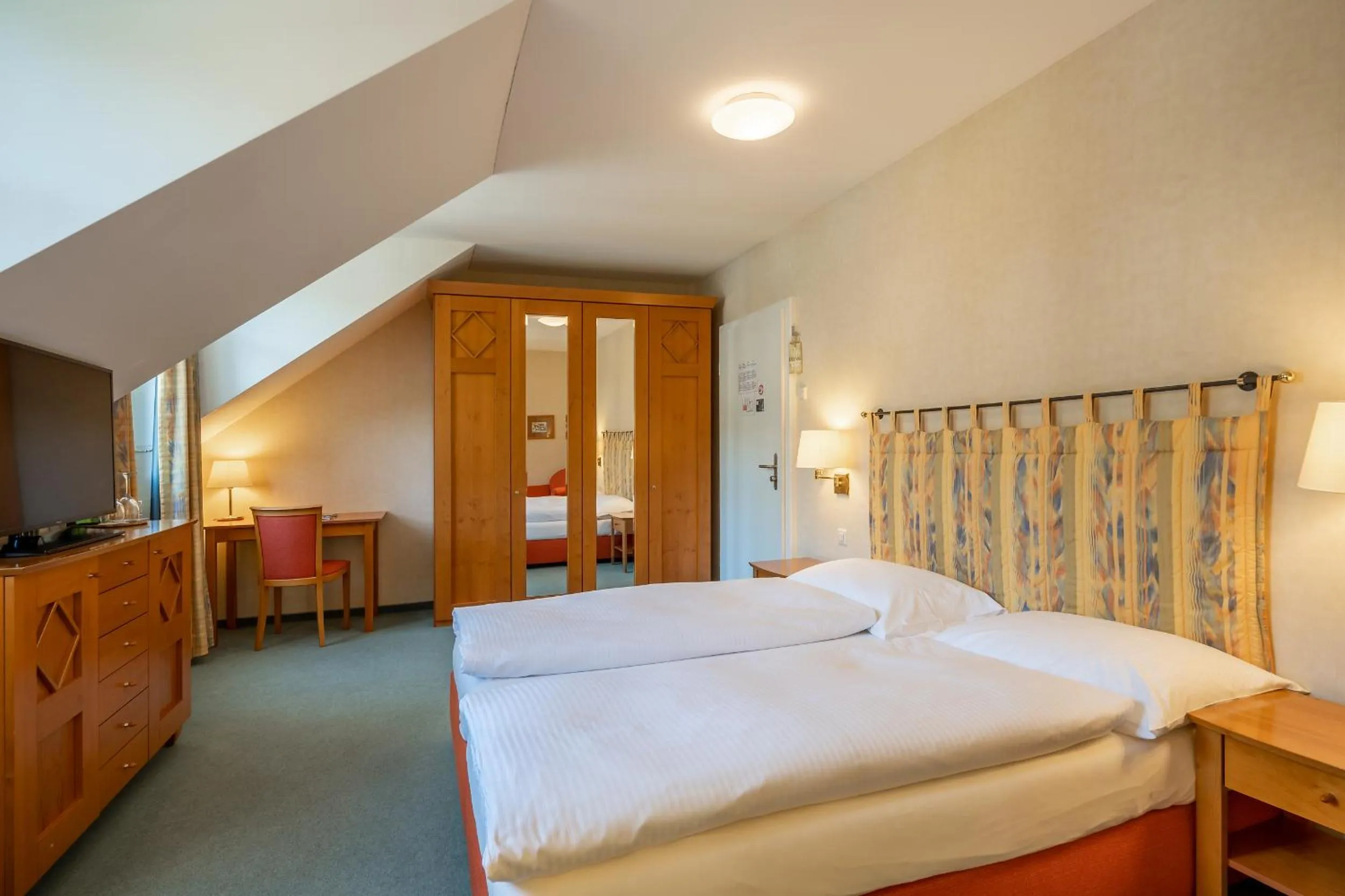 Photo of the whole room, Bed in Schönbühl Hotel & Restaurant Lake Thun