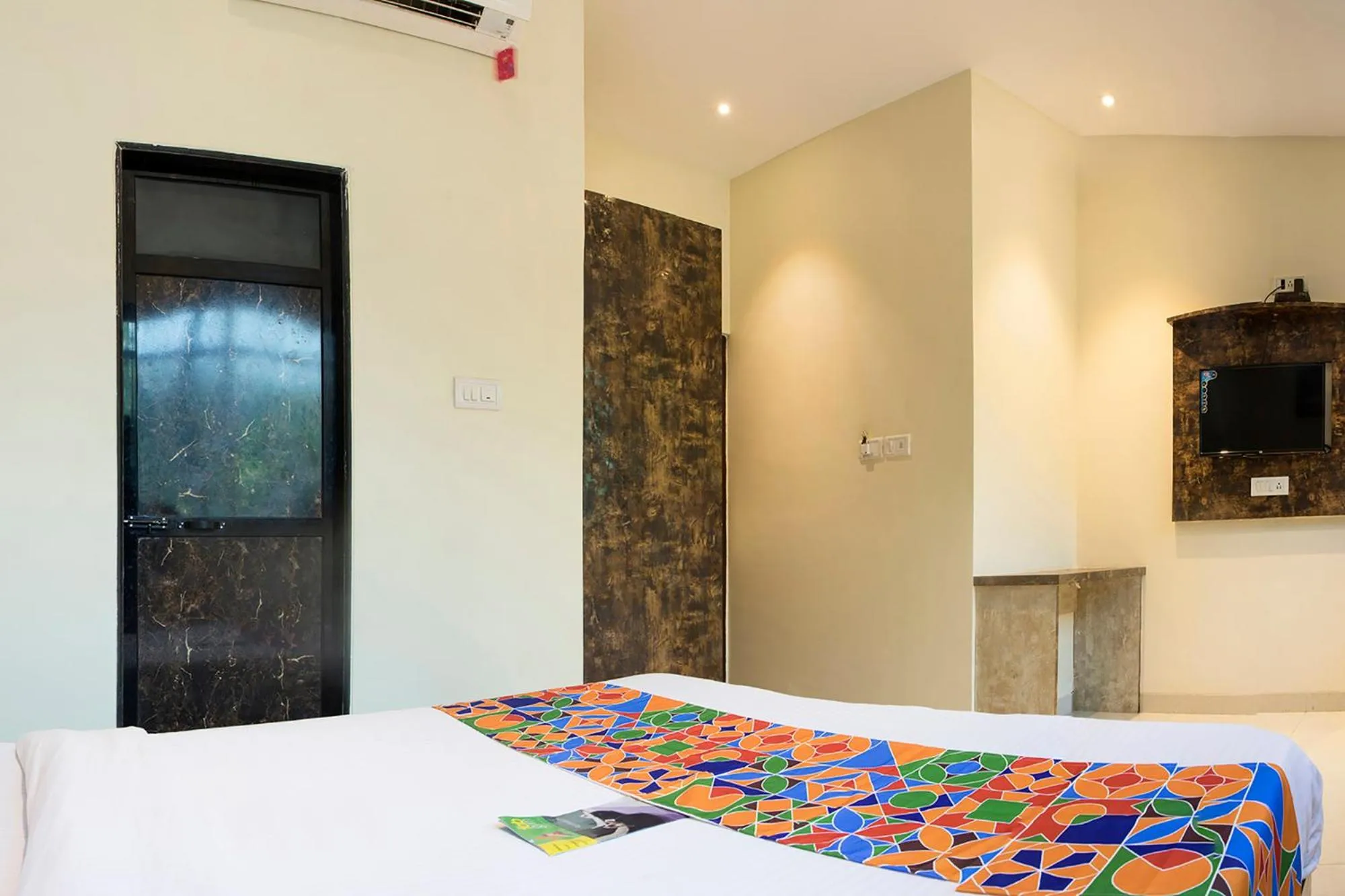 Bed in FabHotel Embassy Grand