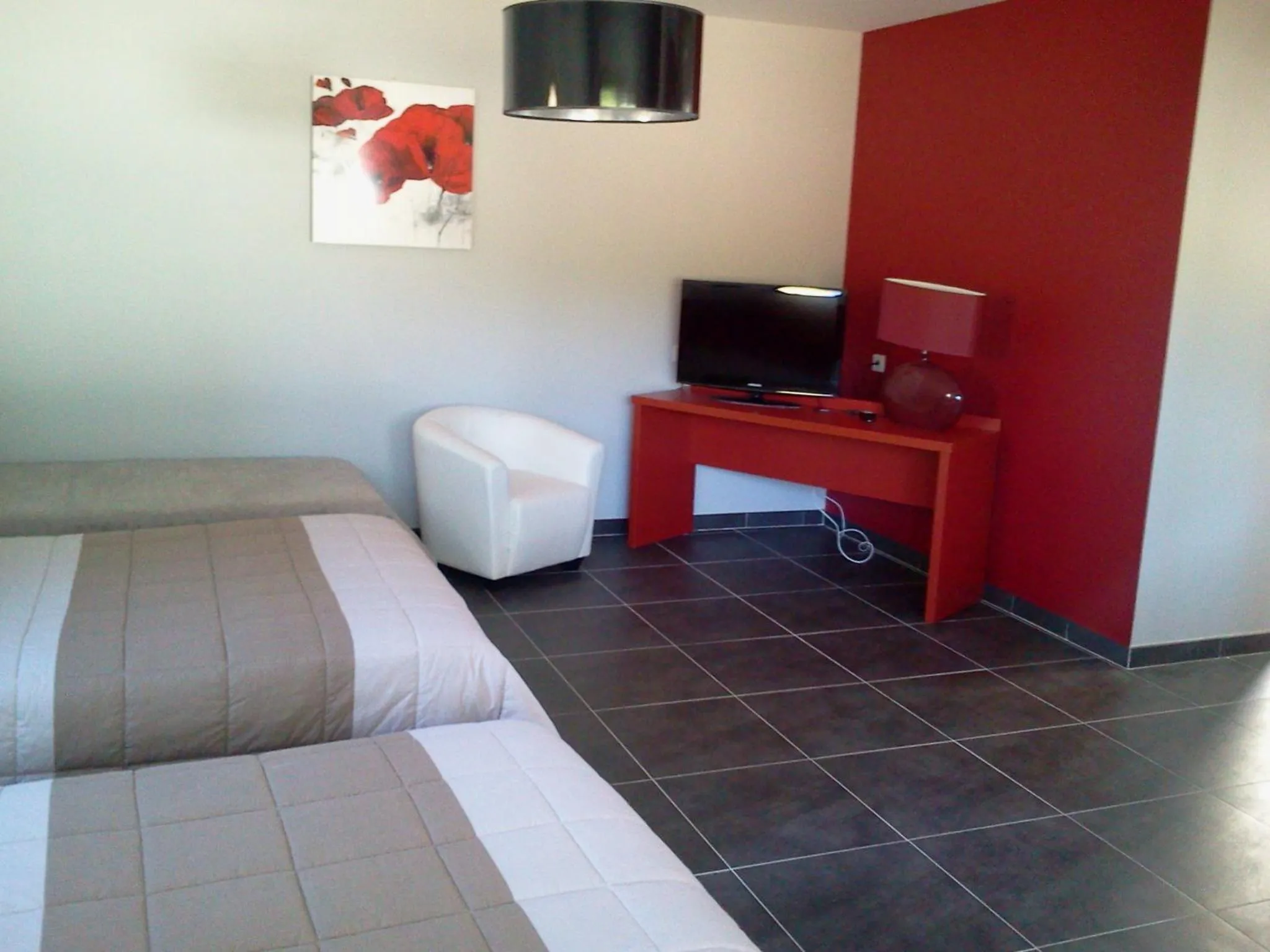 Communal lounge/ TV room, Bed in Logis Hotels - Hôtel et Restaurant Le Relais des Garrigues