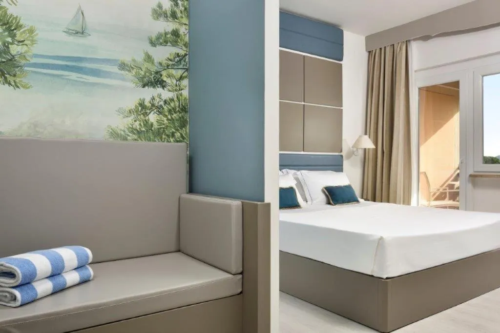 Bed in Golf Hotel Punta Ala