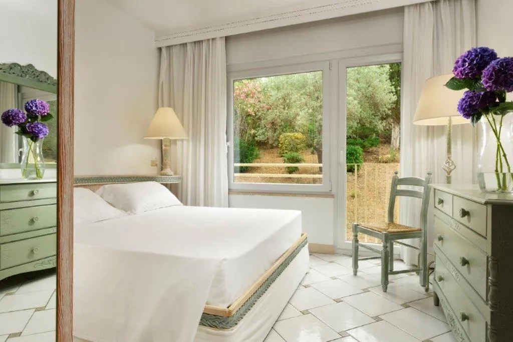 Bed in Golf Hotel Punta Ala