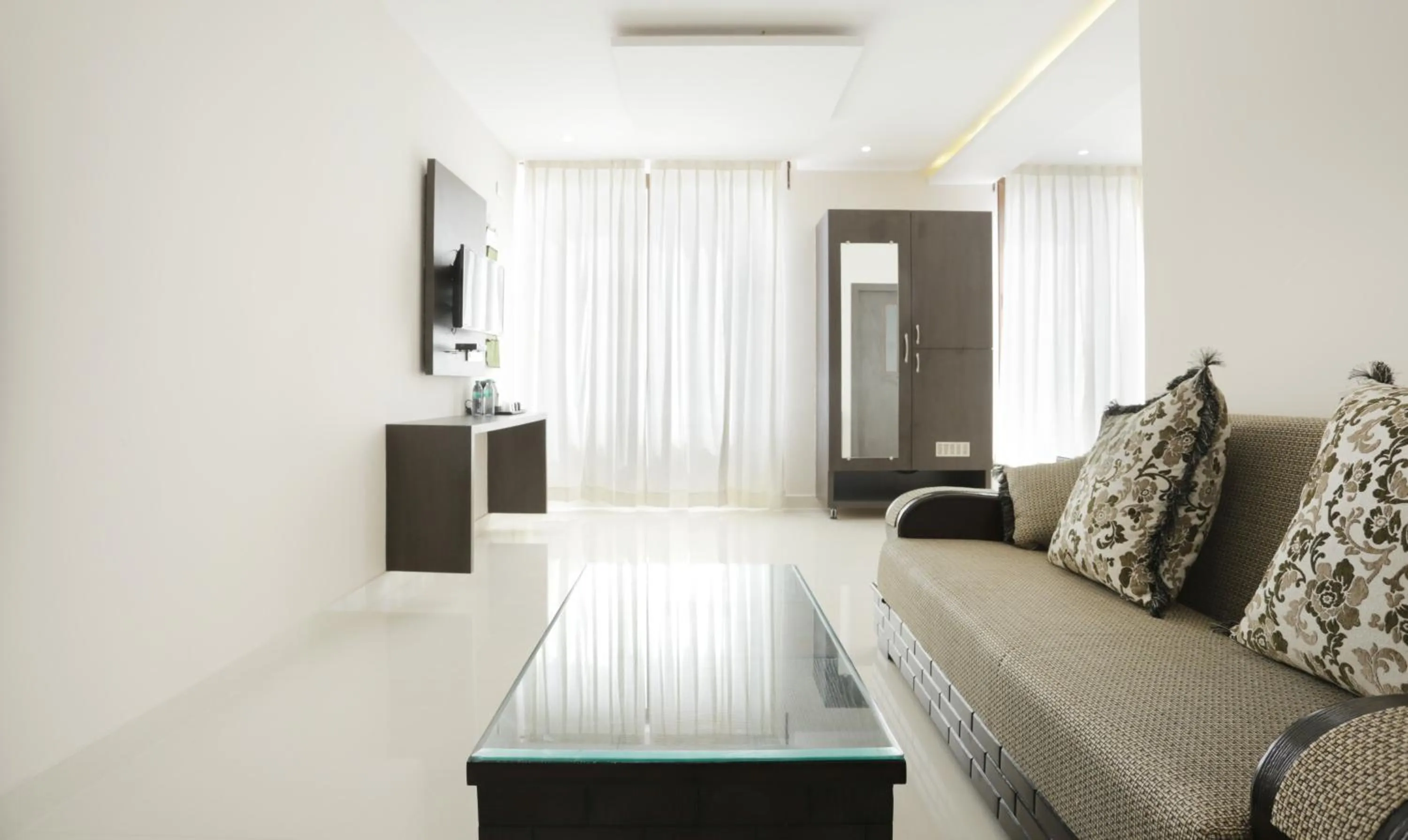 Seating area, Bed in Treebo Sunrise IG Road