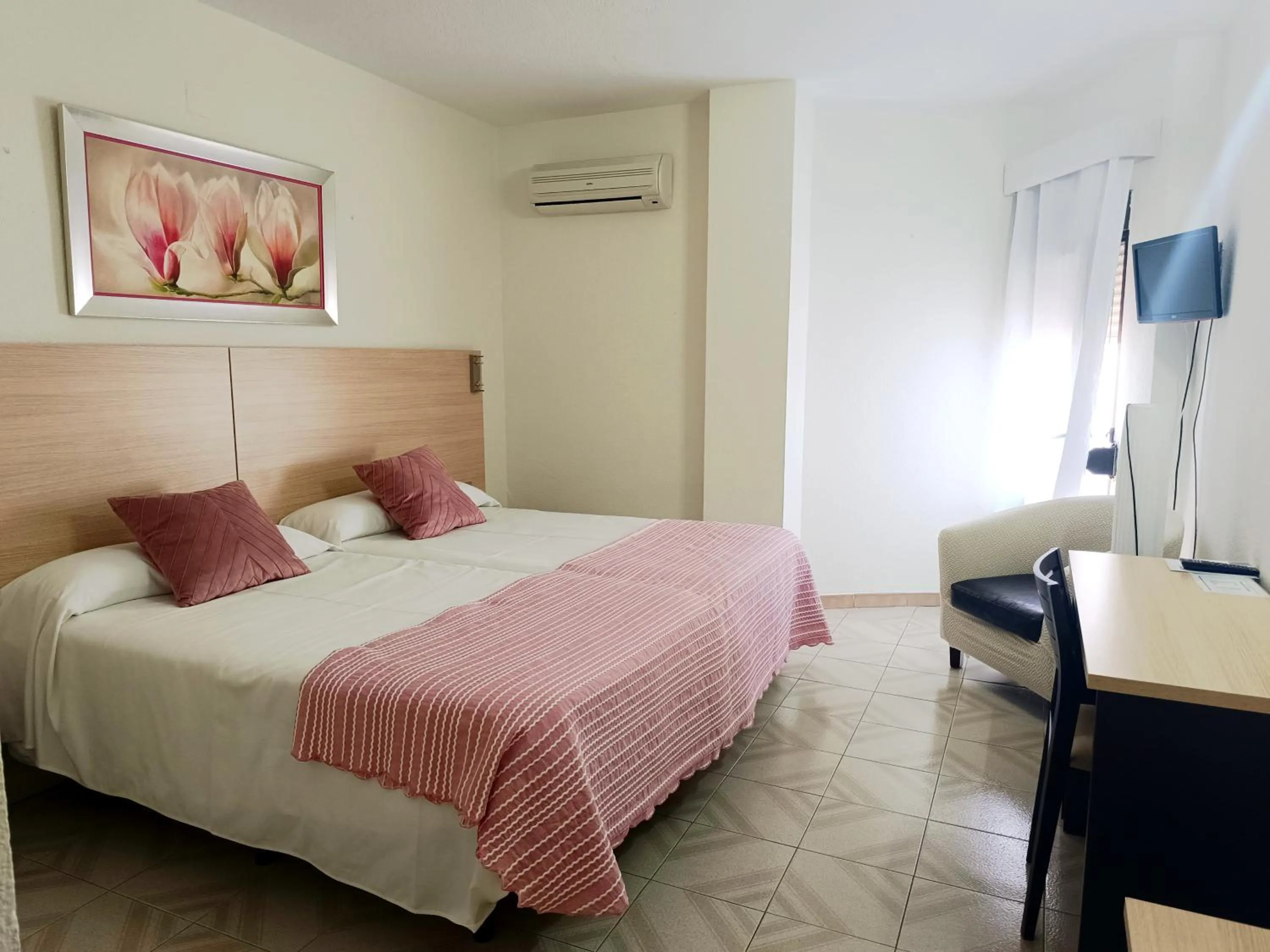 Bed in Hotel Oasis Familiar