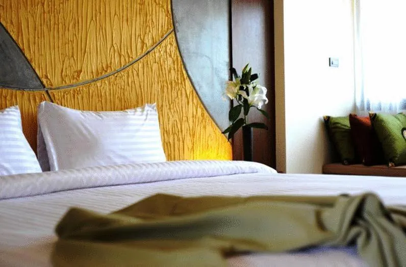 Bed in The Charm Boutique Resort