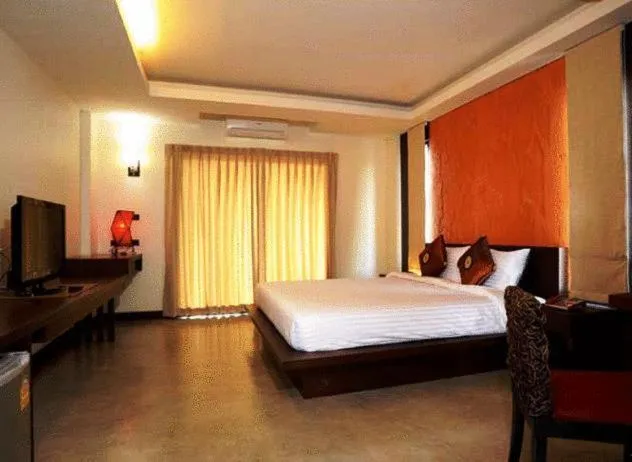 Bed in The Charm Boutique Resort