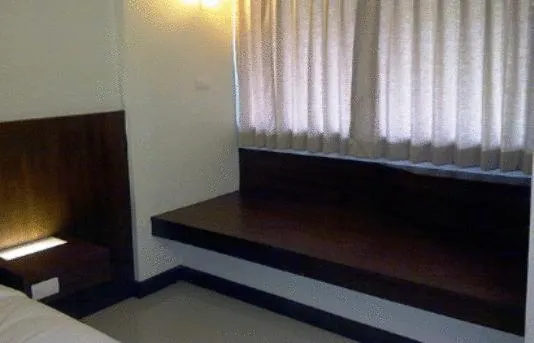 Bed in The Charm Boutique Resort