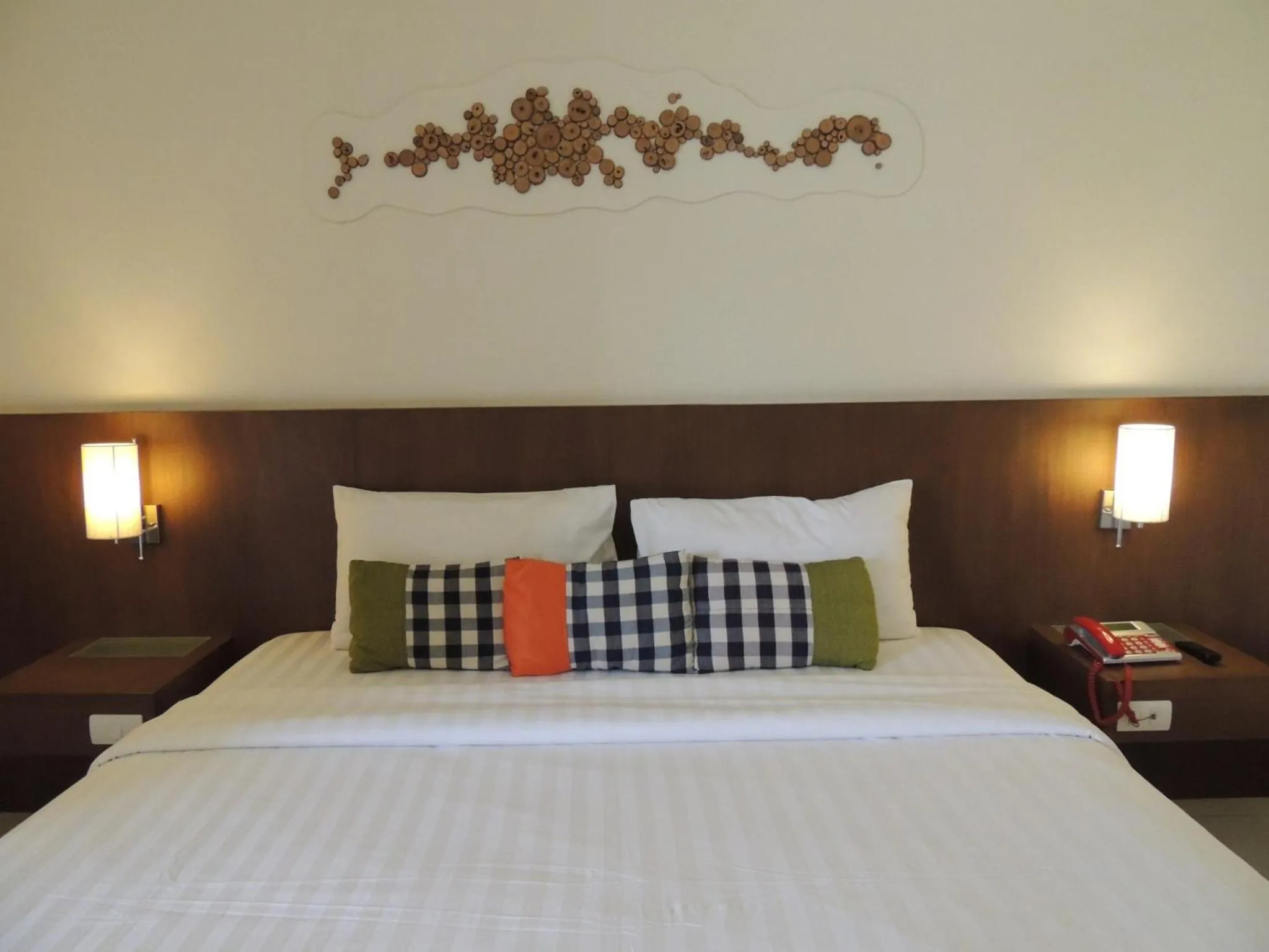 Bed in The Charm Boutique Resort