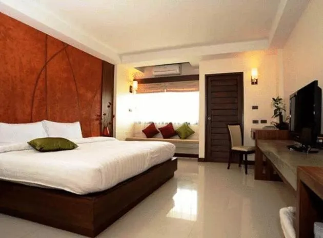 Bed in The Charm Boutique Resort
