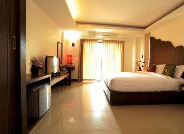 Bed in The Charm Boutique Resort