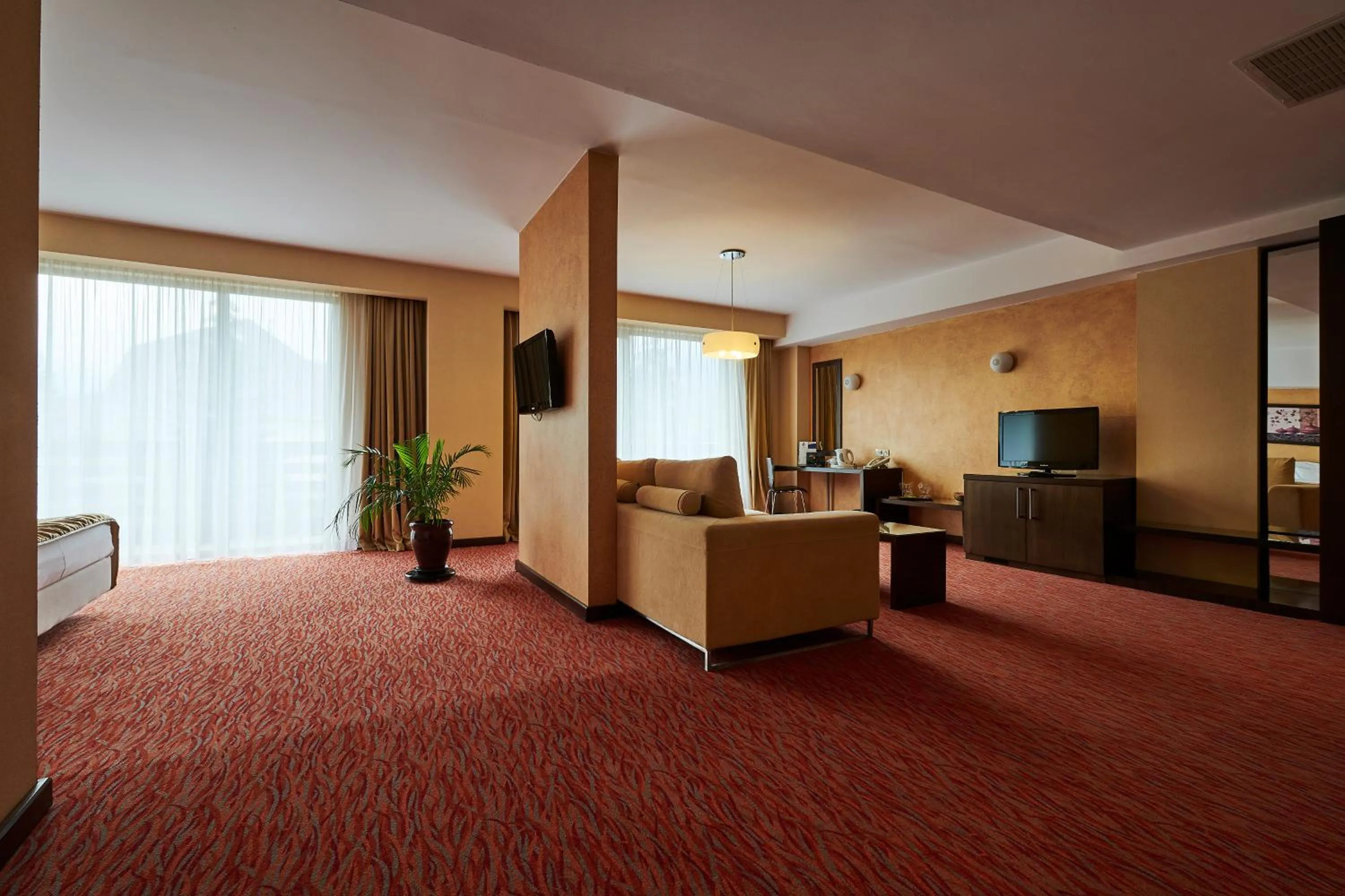 Living room, Bed in Hotel Clermont