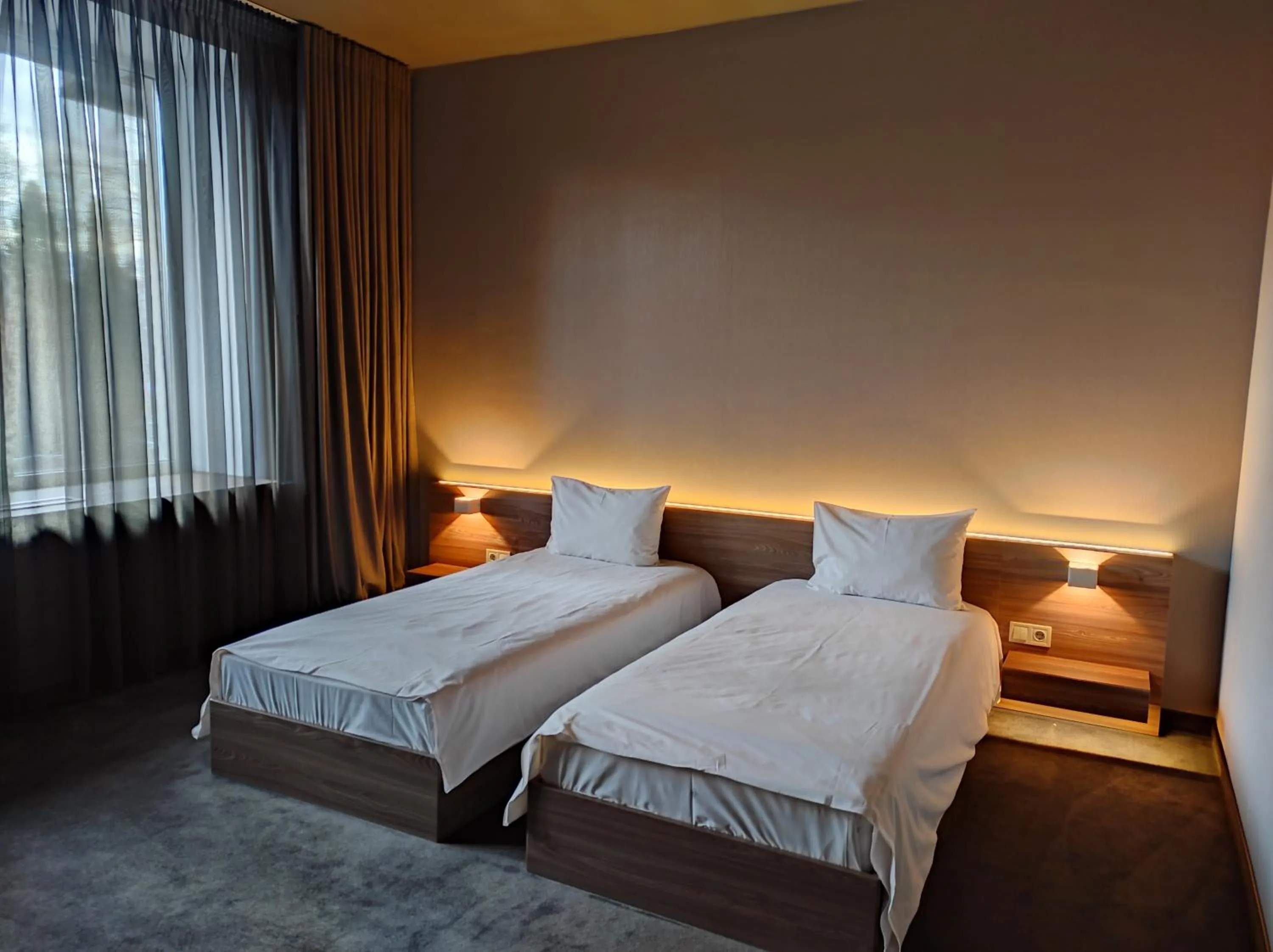 Bed in Jolly Alon Hotel & Business Center