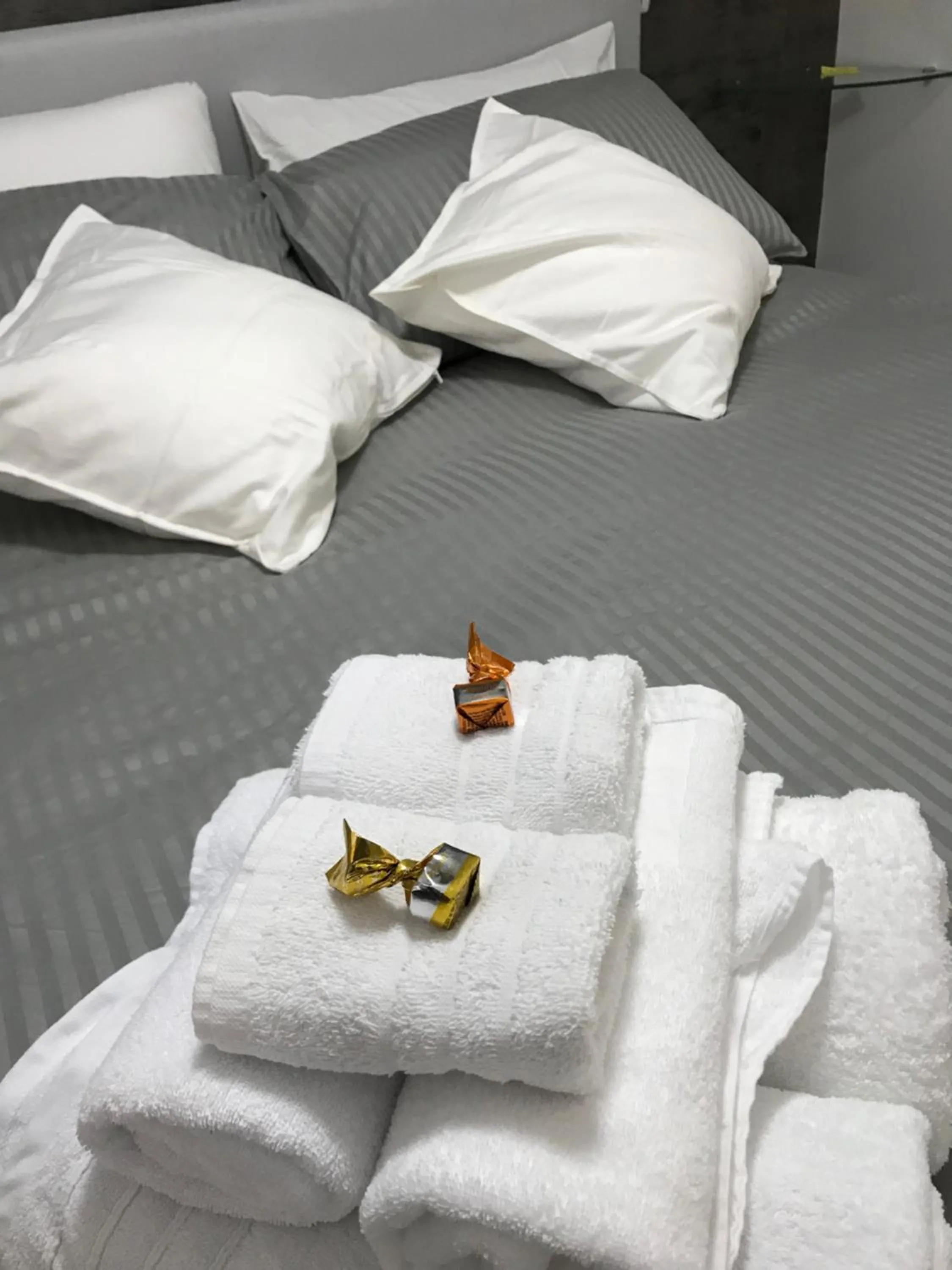 Bed in Terrazza Aragon Room and SPA