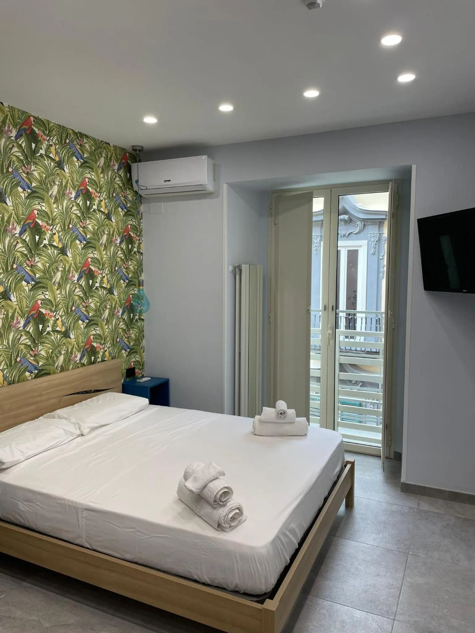 Bed in Terrazza Aragon Room and SPA