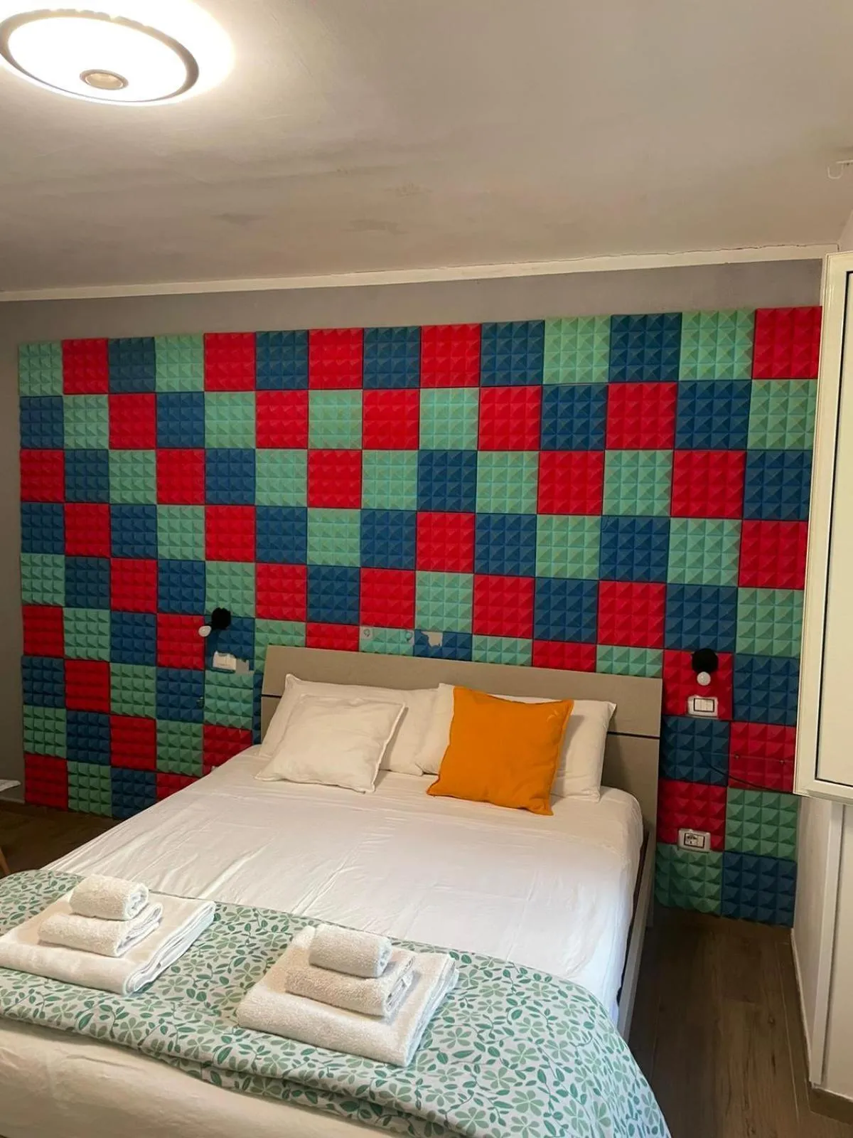 Bed in Terrazza Aragon Room and SPA