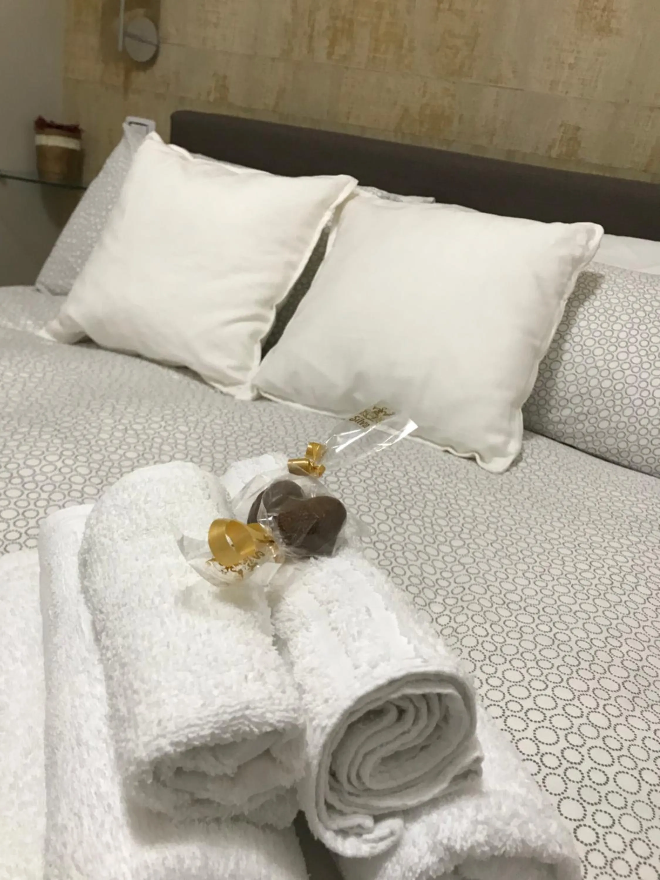 Bed in Terrazza Aragon Room and SPA