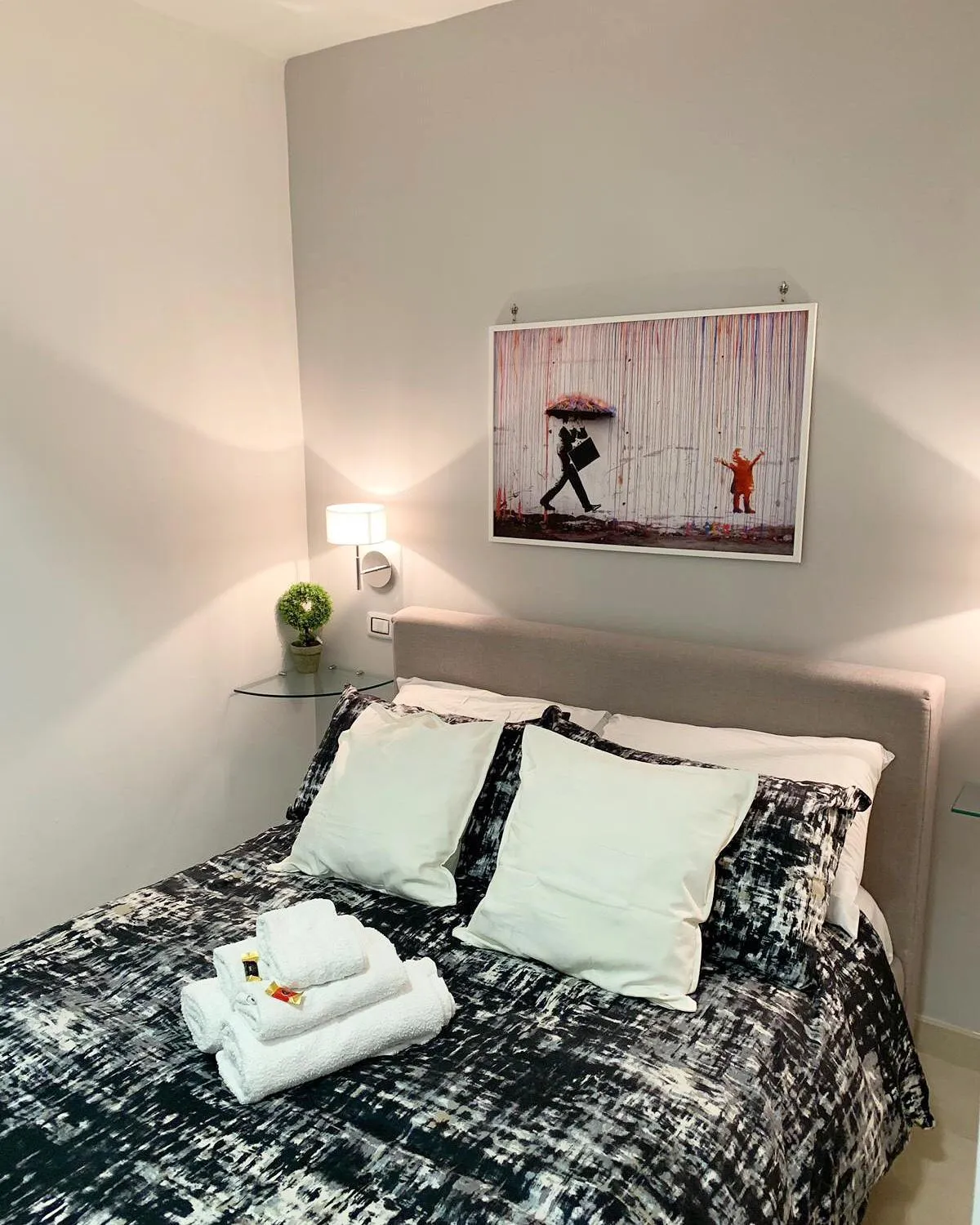 Bed in Terrazza Aragon Room and SPA