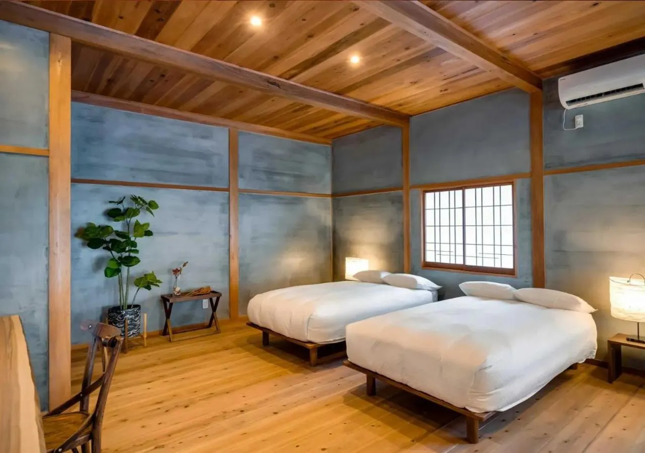 Bed in NIPPONIA Sawara Merchant Town Hotel