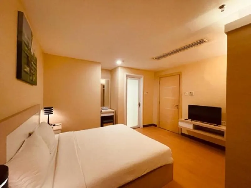 Bed in Jinhold Apartment Hotel