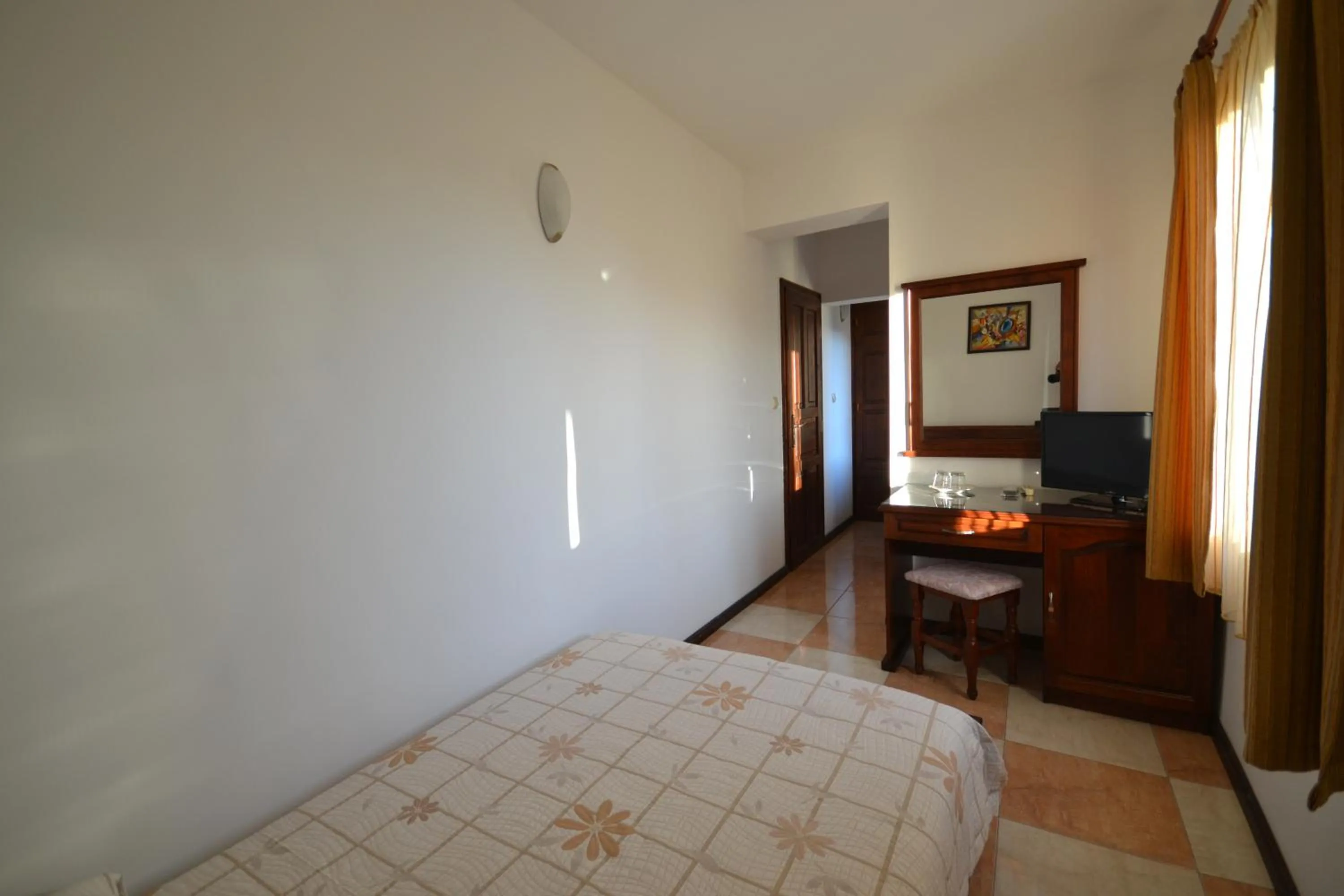 Communal lounge/ TV room, Bed in More Family Hotel
