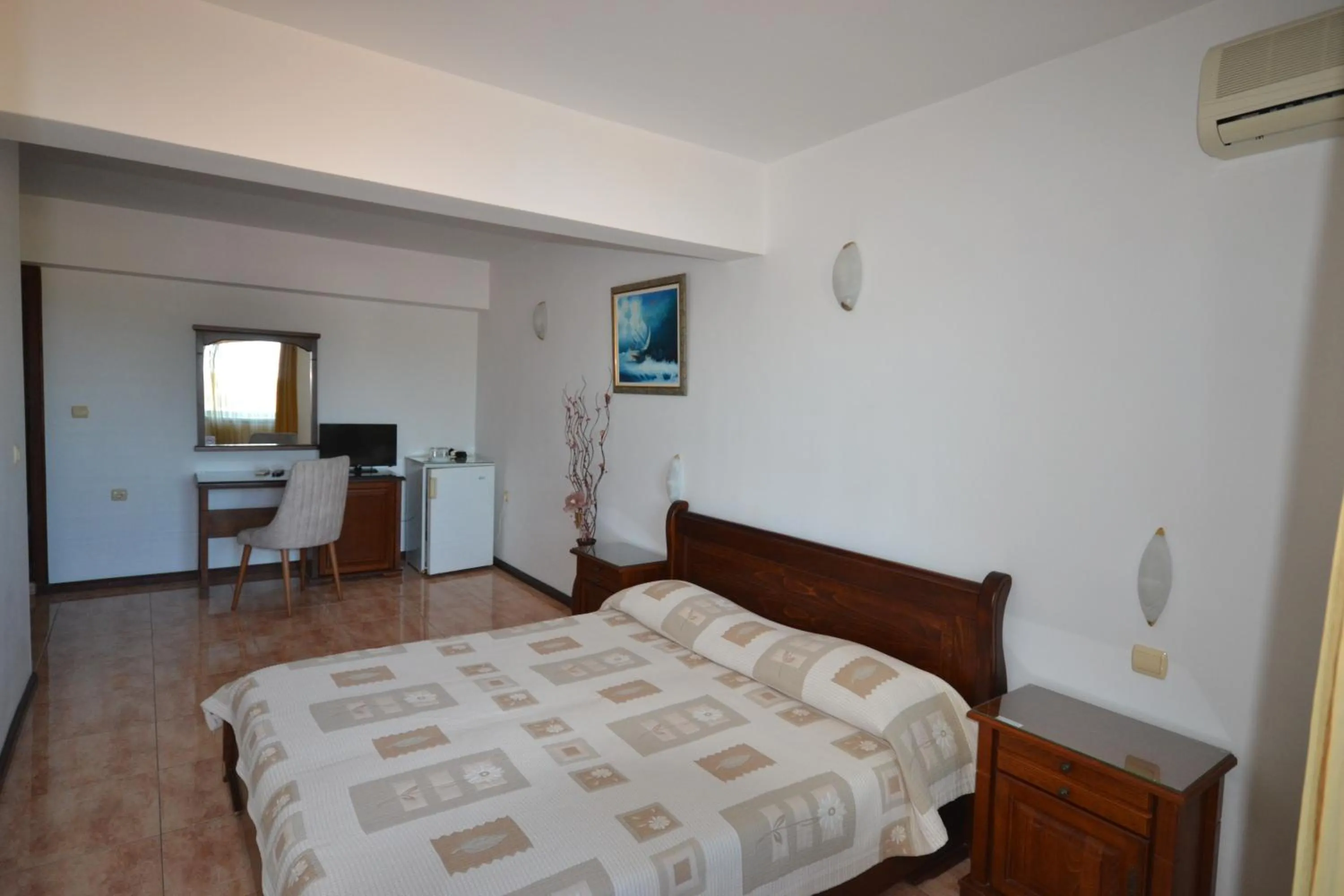 Communal lounge/ TV room, Bed in More Family Hotel