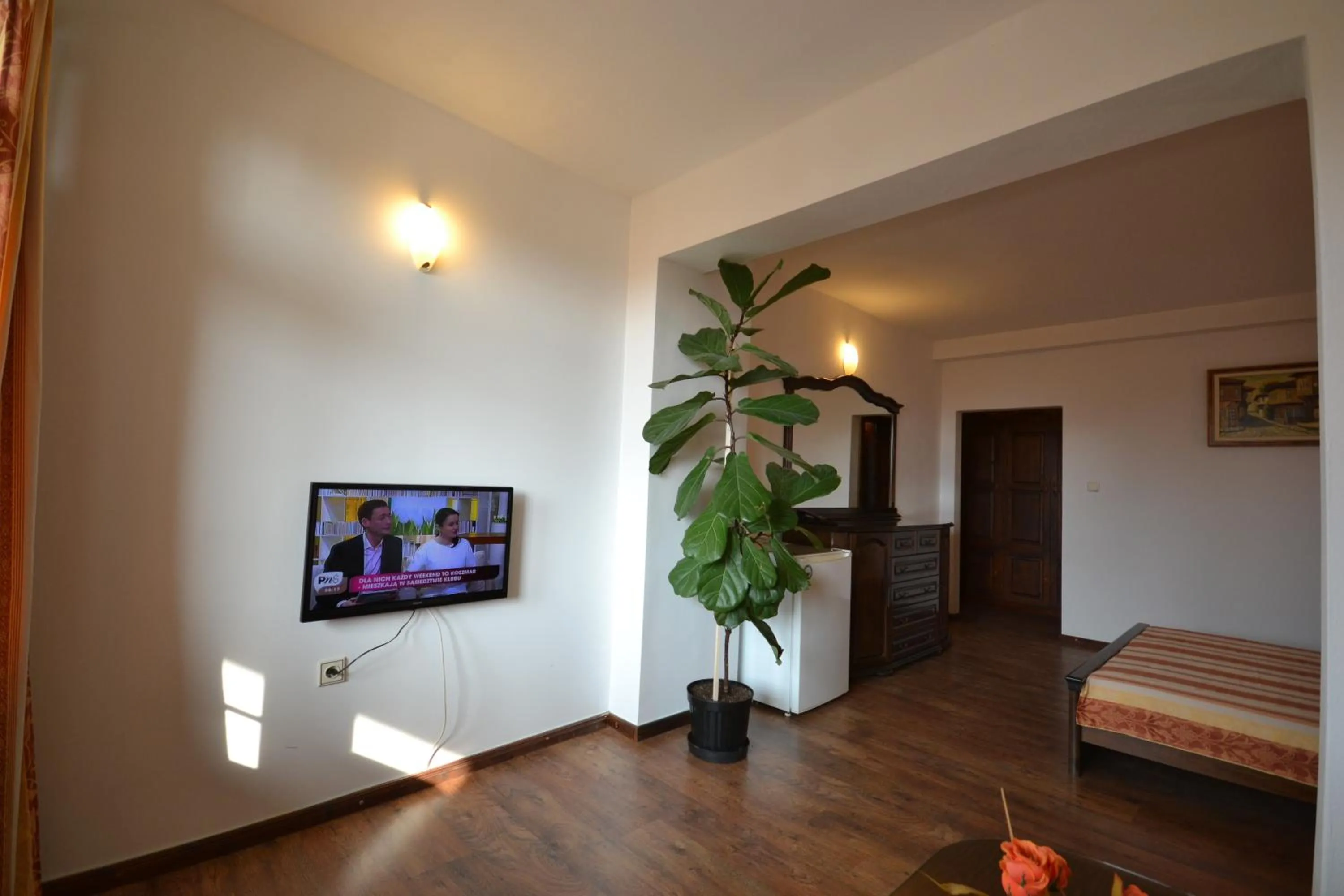 Communal lounge/ TV room, Bed in More Family Hotel