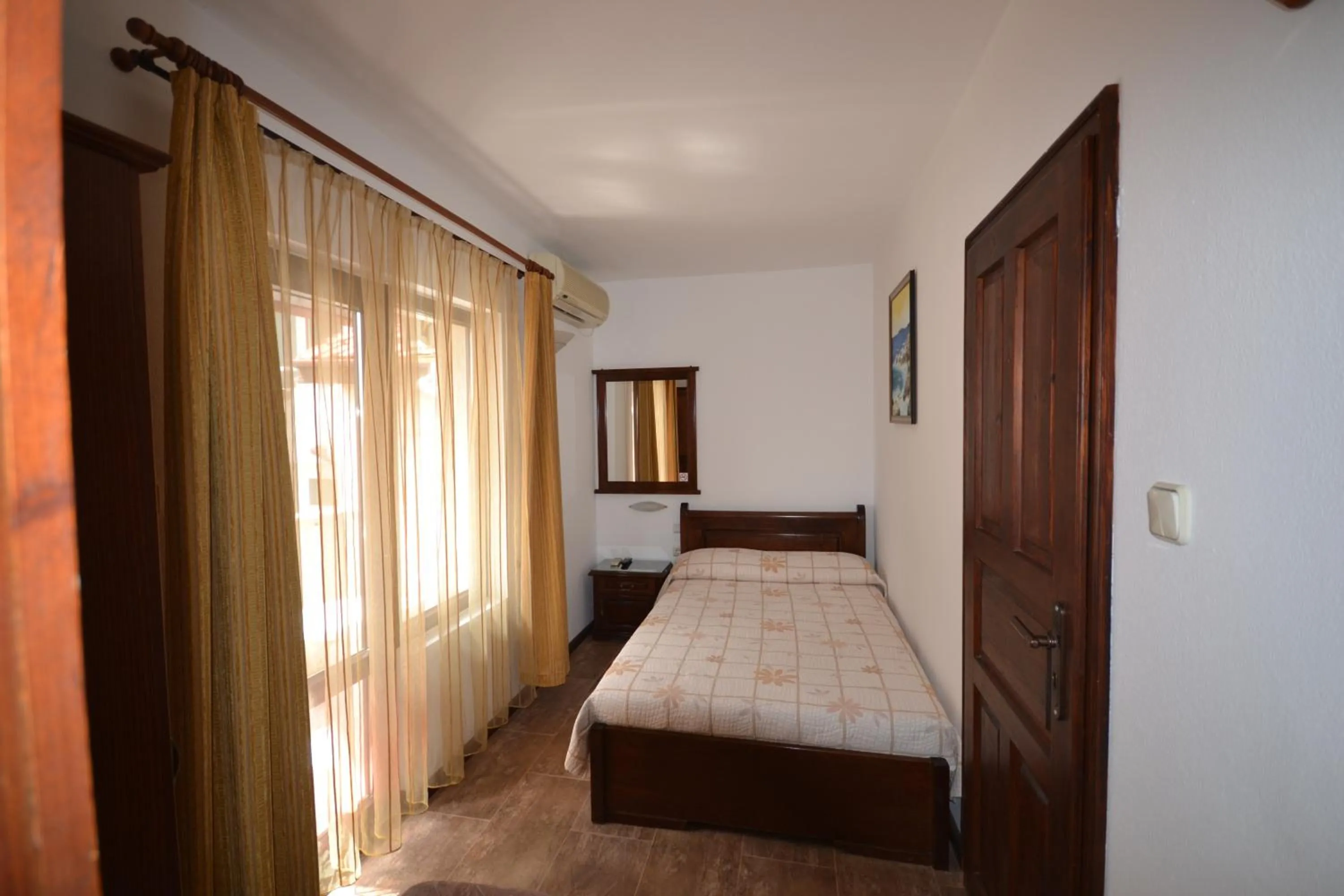 Communal lounge/ TV room, Bed in More Family Hotel