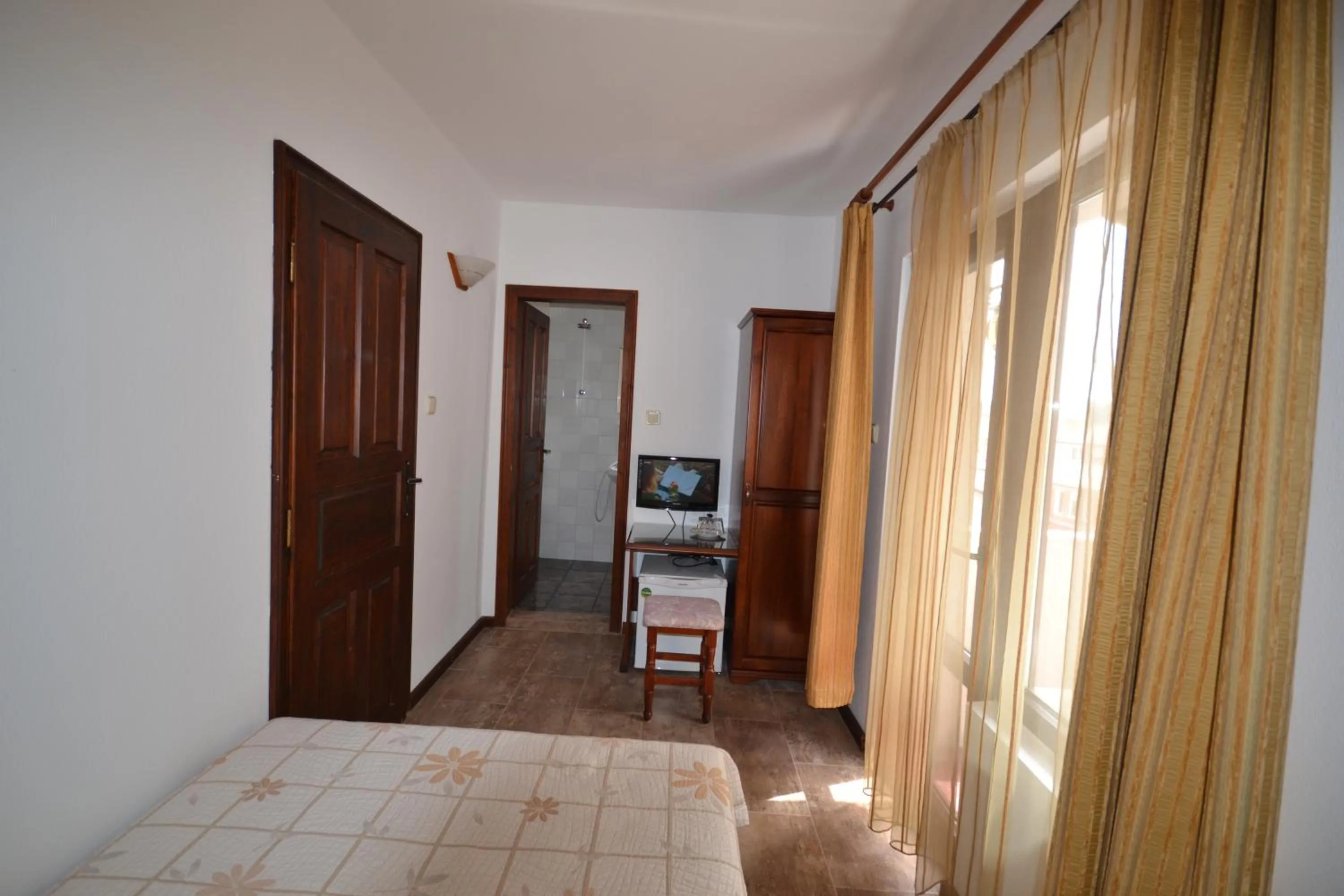 Communal lounge/ TV room, Bed in More Family Hotel