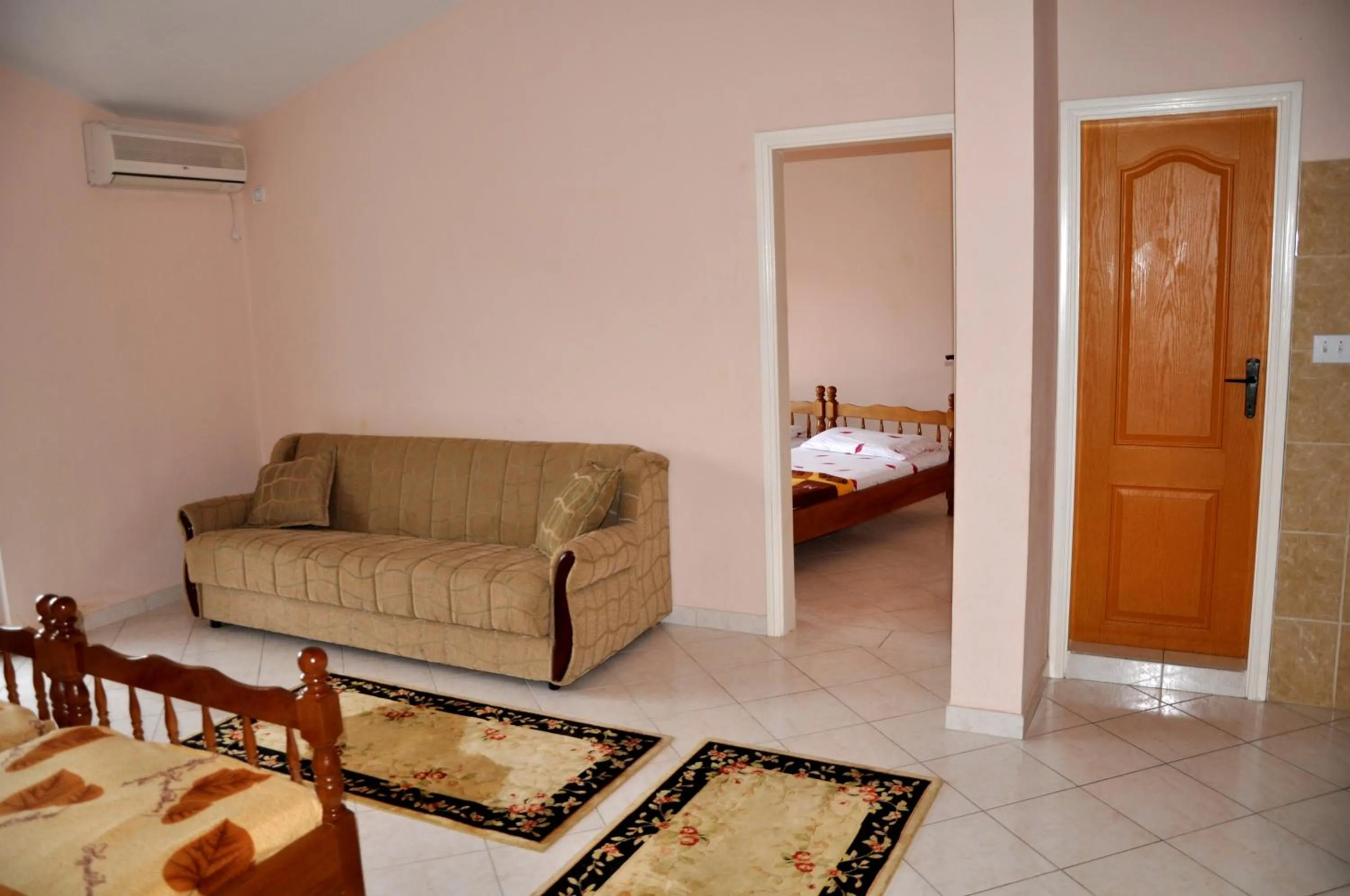 Seating area, Bed in Apartments Perezaj