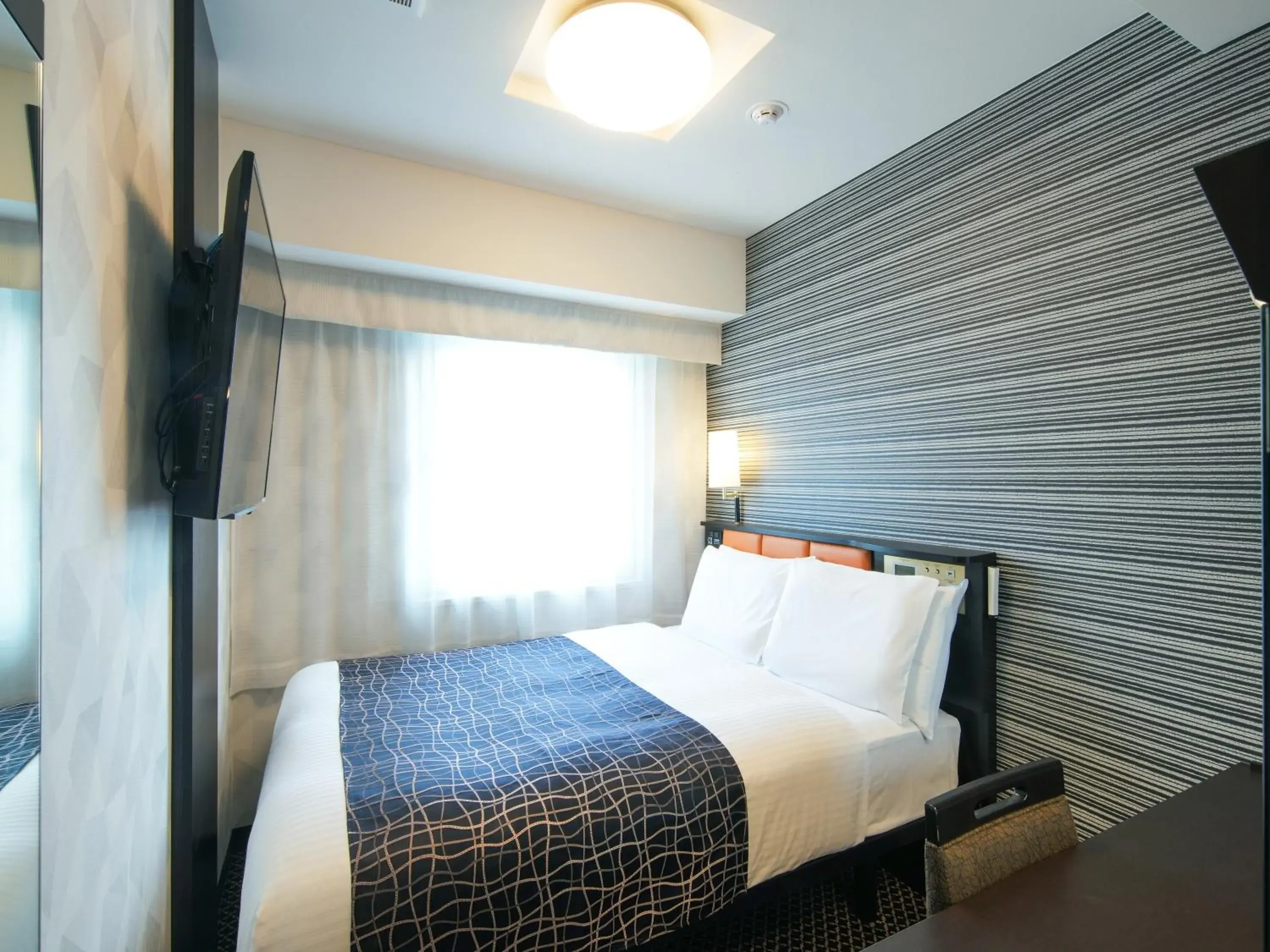 Bed in APA Hotel Higashi Umeda Minami Morimachi Ekimae Bed in APA Hotel Higashi Umeda Minami Morimachi Ekimae