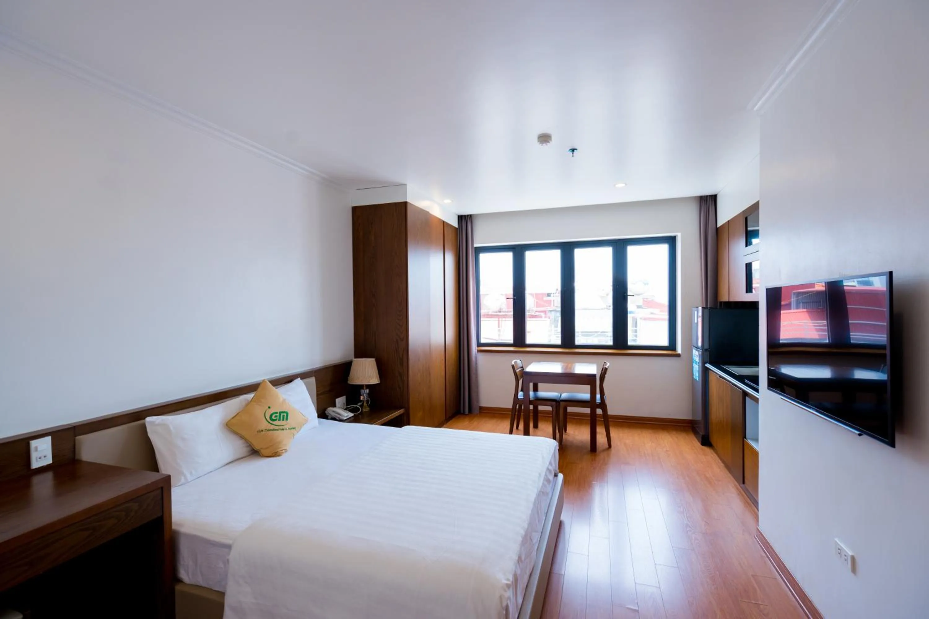 Living room, Bed in GM Hotel and Apartment