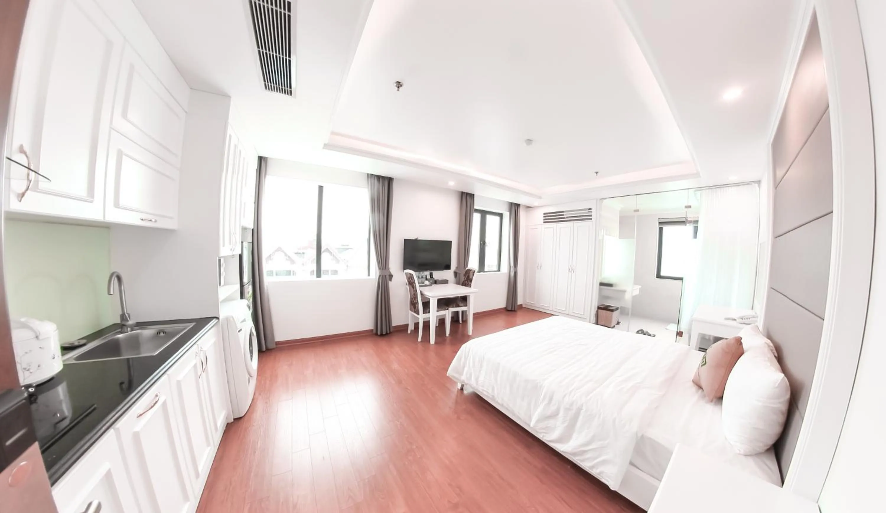 Kitchen or kitchenette, Bed in GM Hotel and Apartment