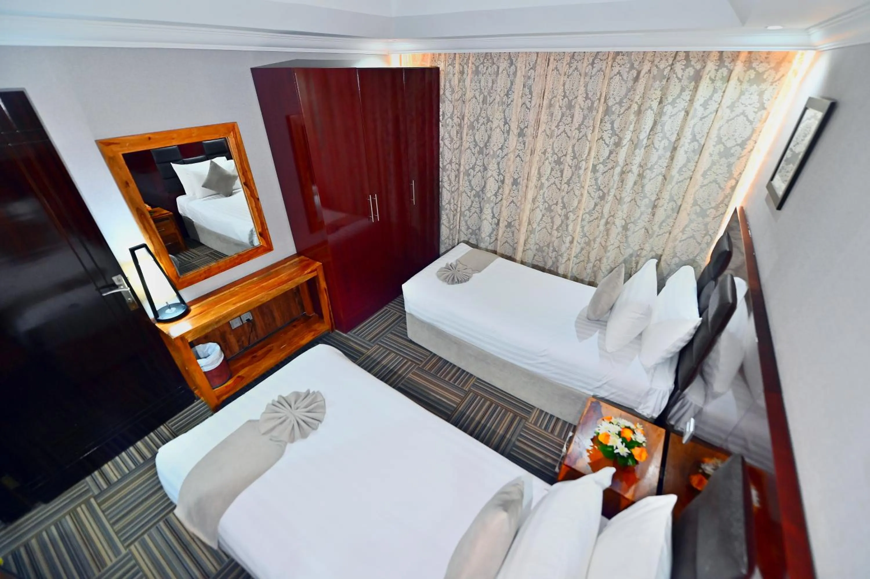 Bed in Ewan Ajman Suites Hotel