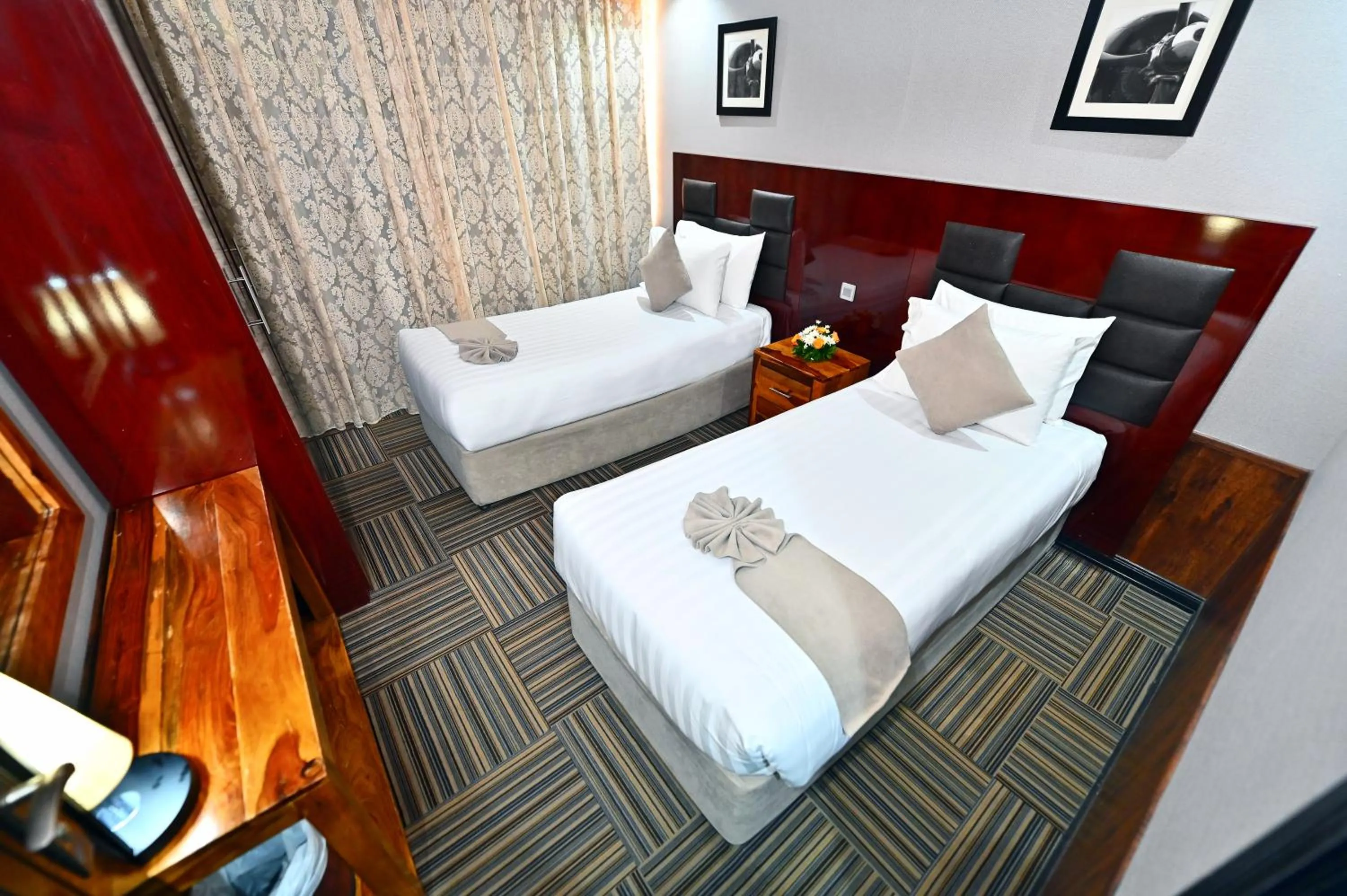 Bed in Ewan Ajman Suites Hotel