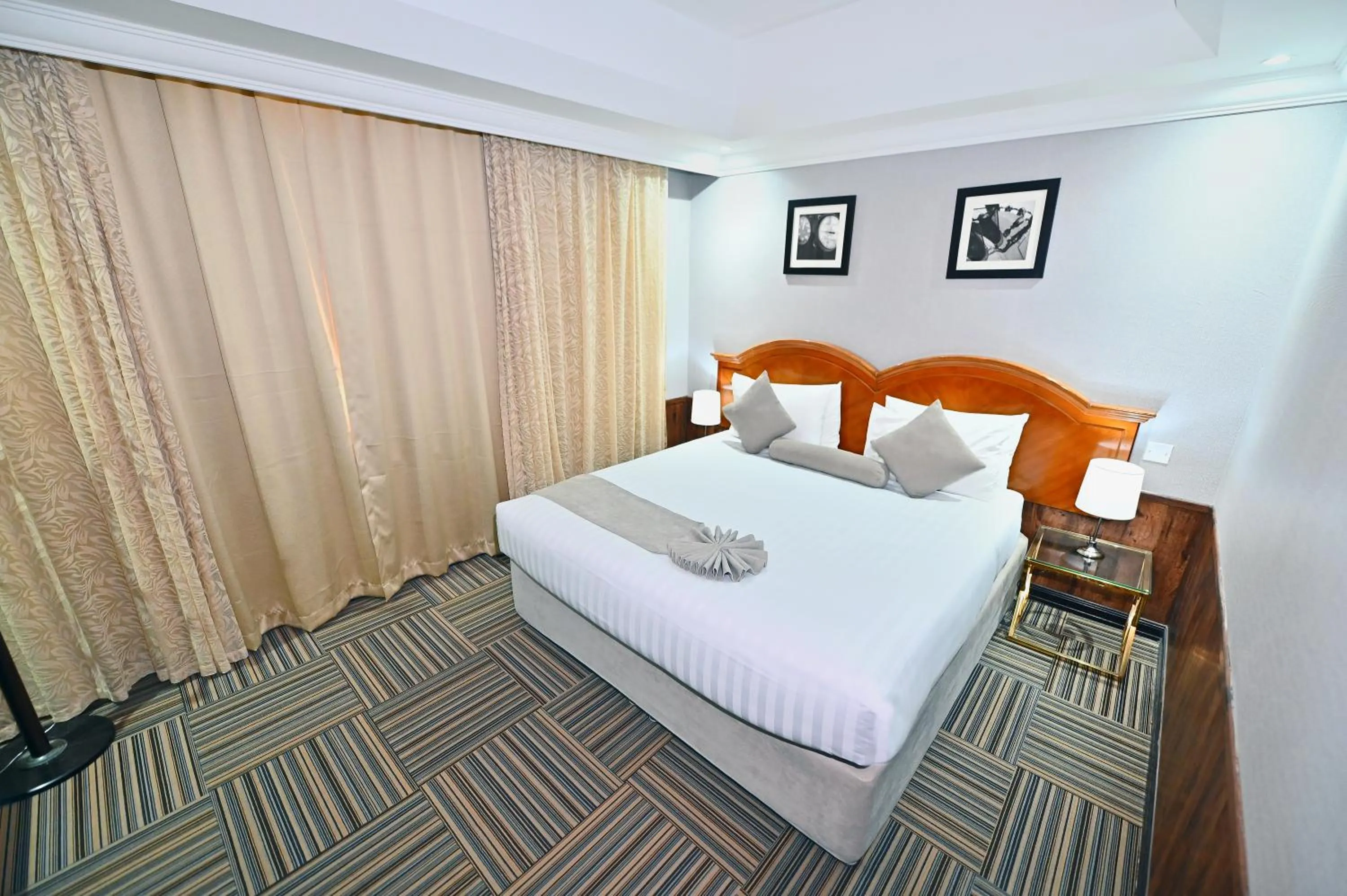 Bed in Ewan Ajman Suites Hotel