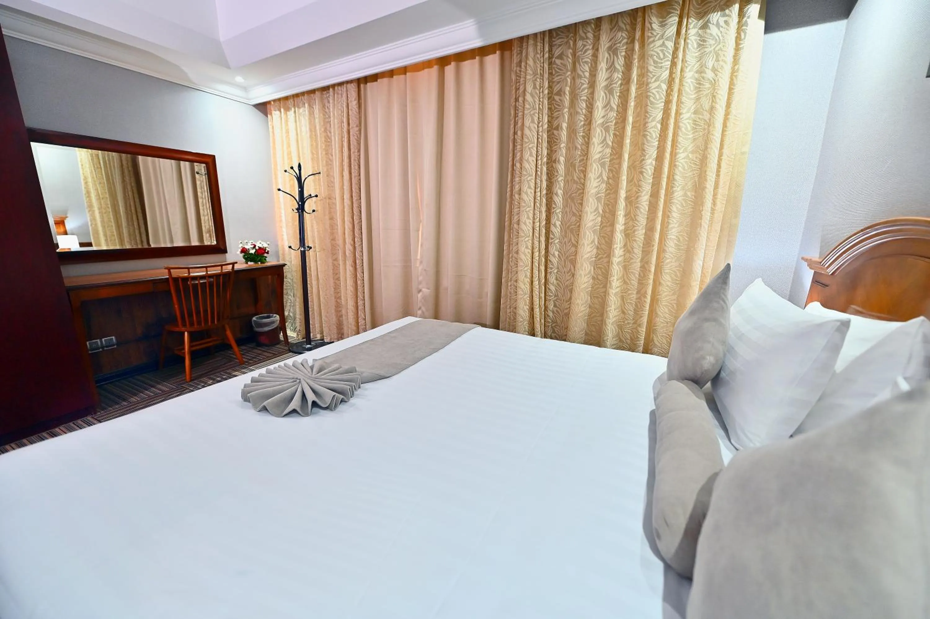 Bed in Ewan Ajman Suites Hotel