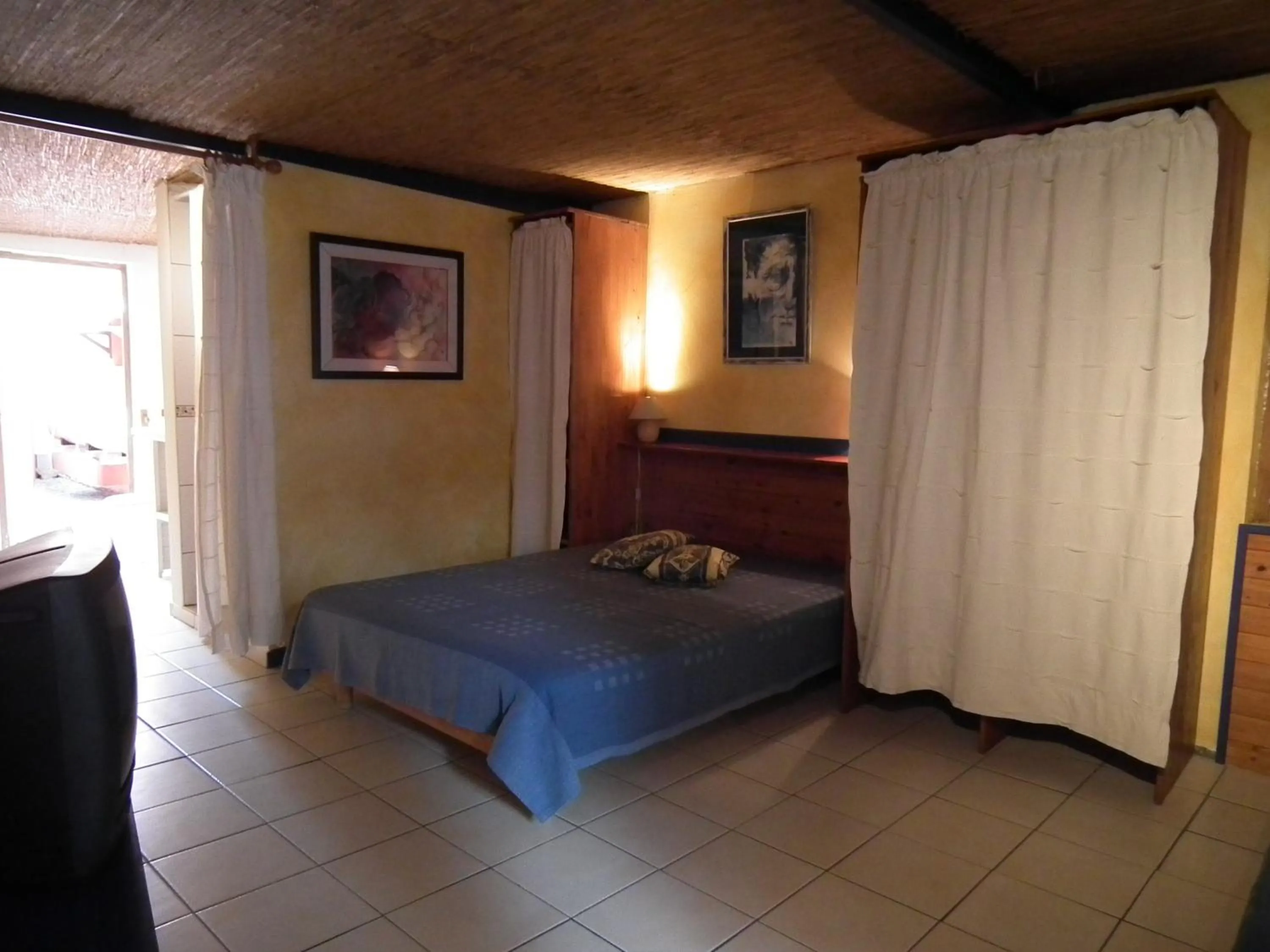 Bed in Le Cardinal des Grands Bleus