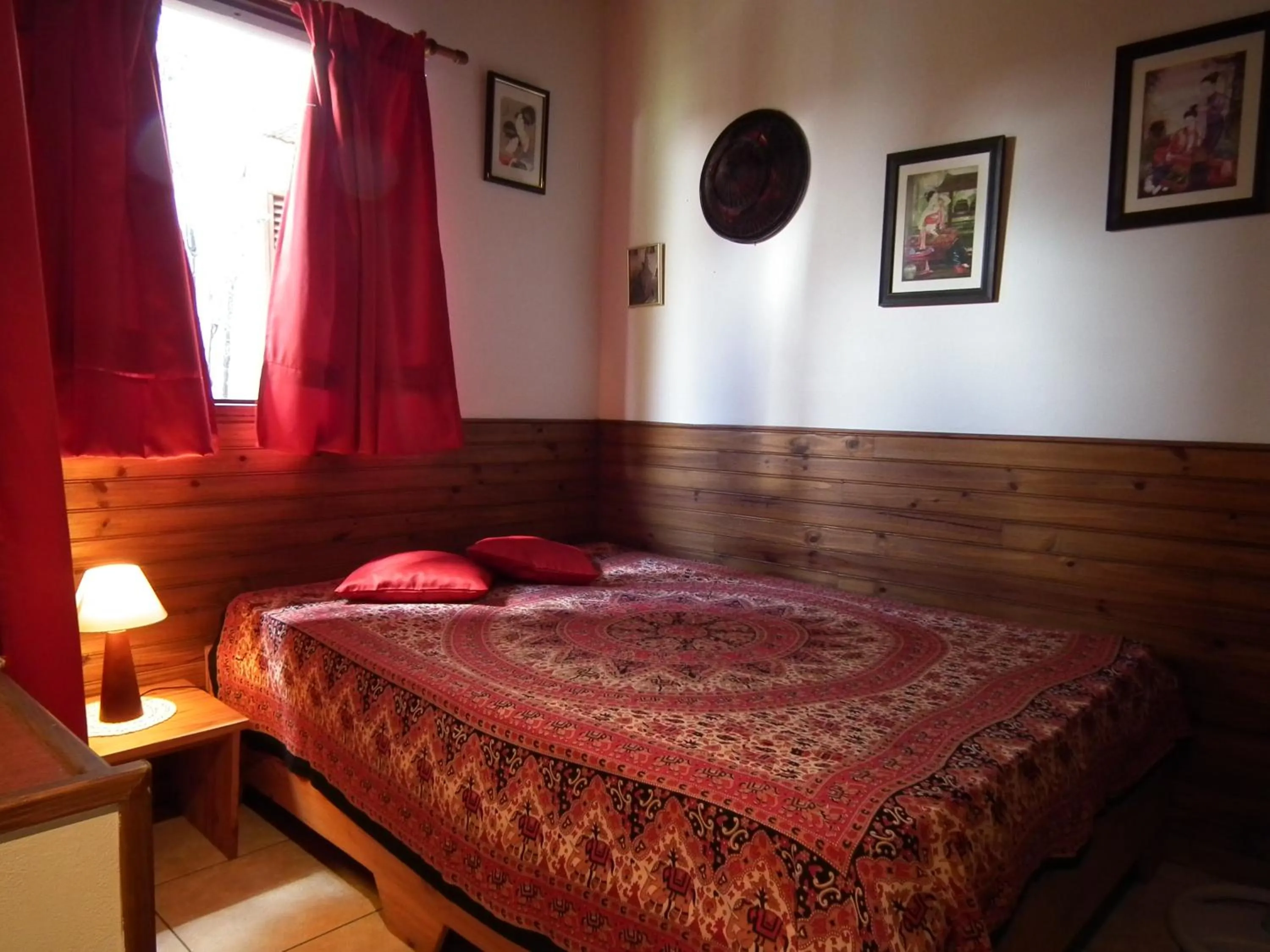 Bed in Le Cardinal des Grands Bleus