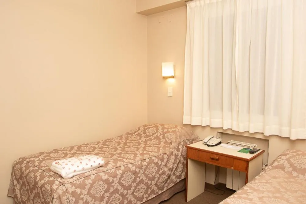 Bed in Comodoro Hotel