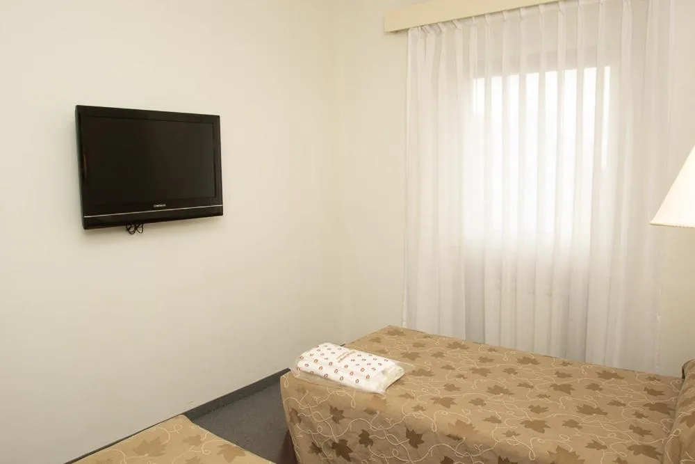 Bed in Comodoro Hotel