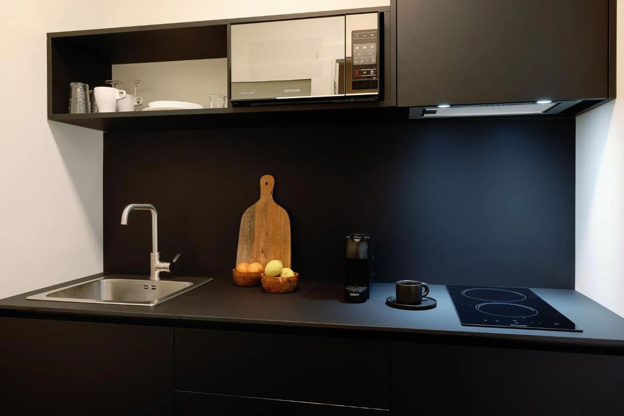 kitchen in Cosme Apartments by Olala Homes