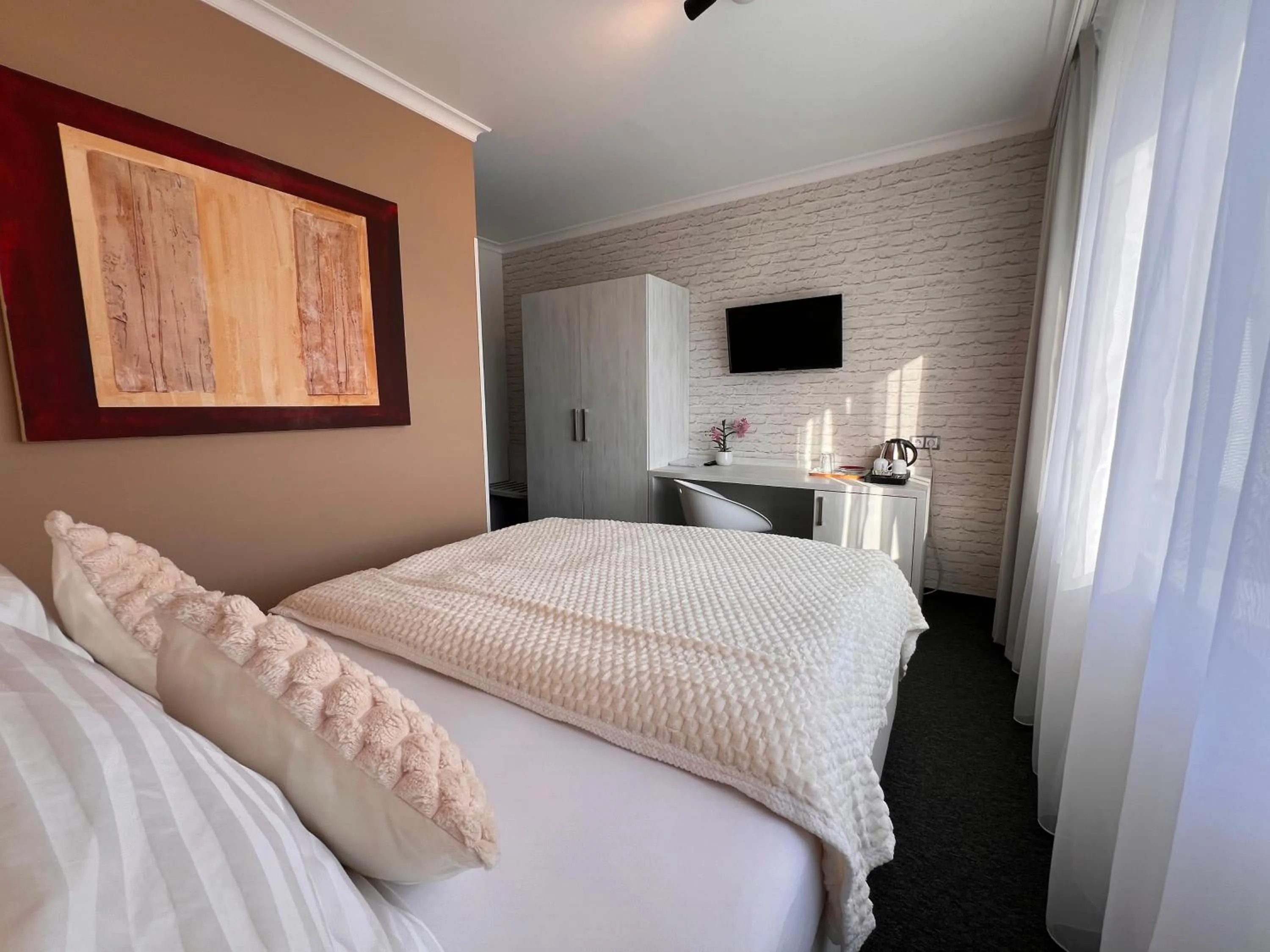 Bed in Grand Petit Hotel ex Shato Gesson