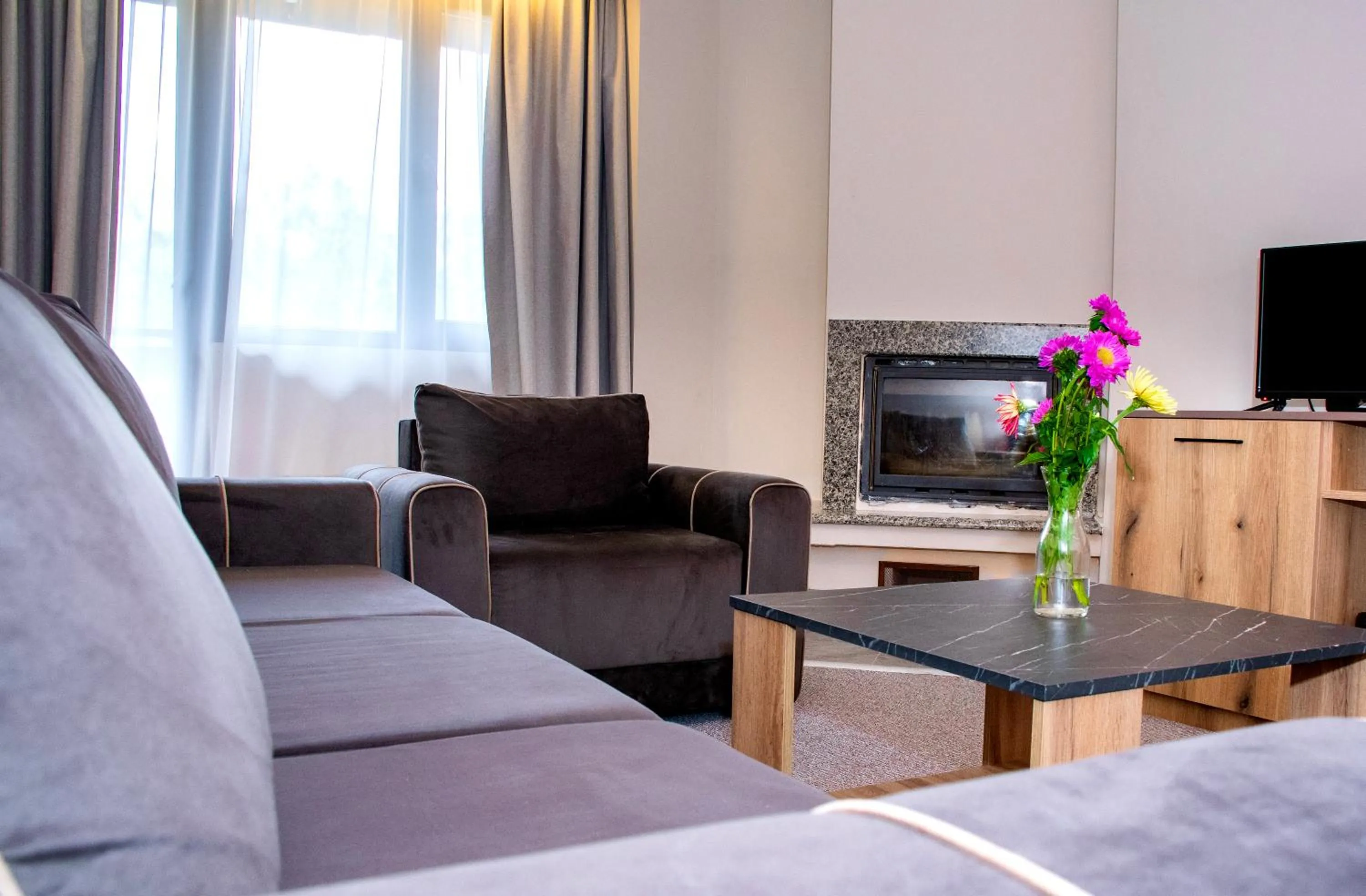 Communal lounge/ TV room in Hotel Orphey