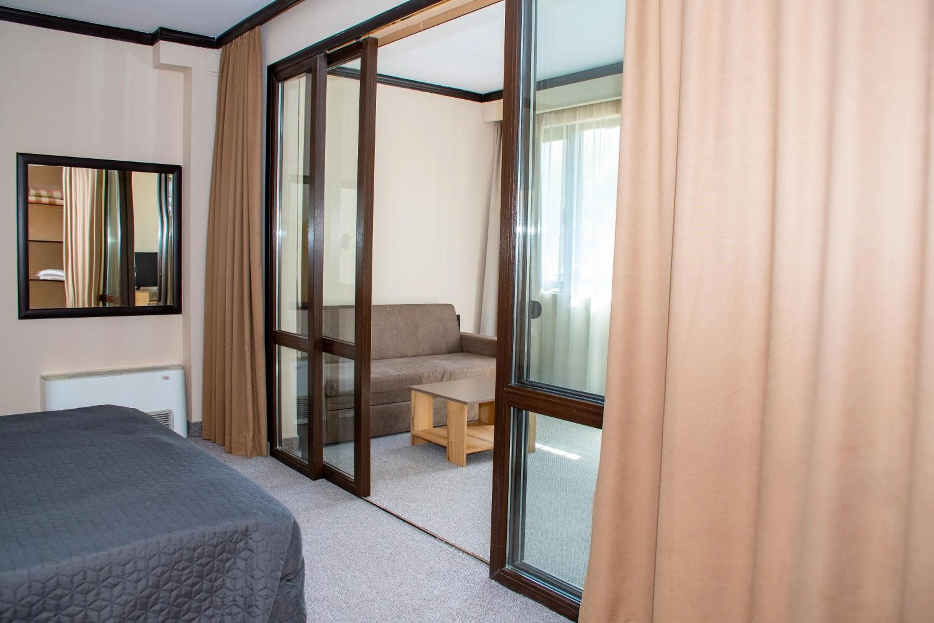 Living room, Bed in Hotel Orphey