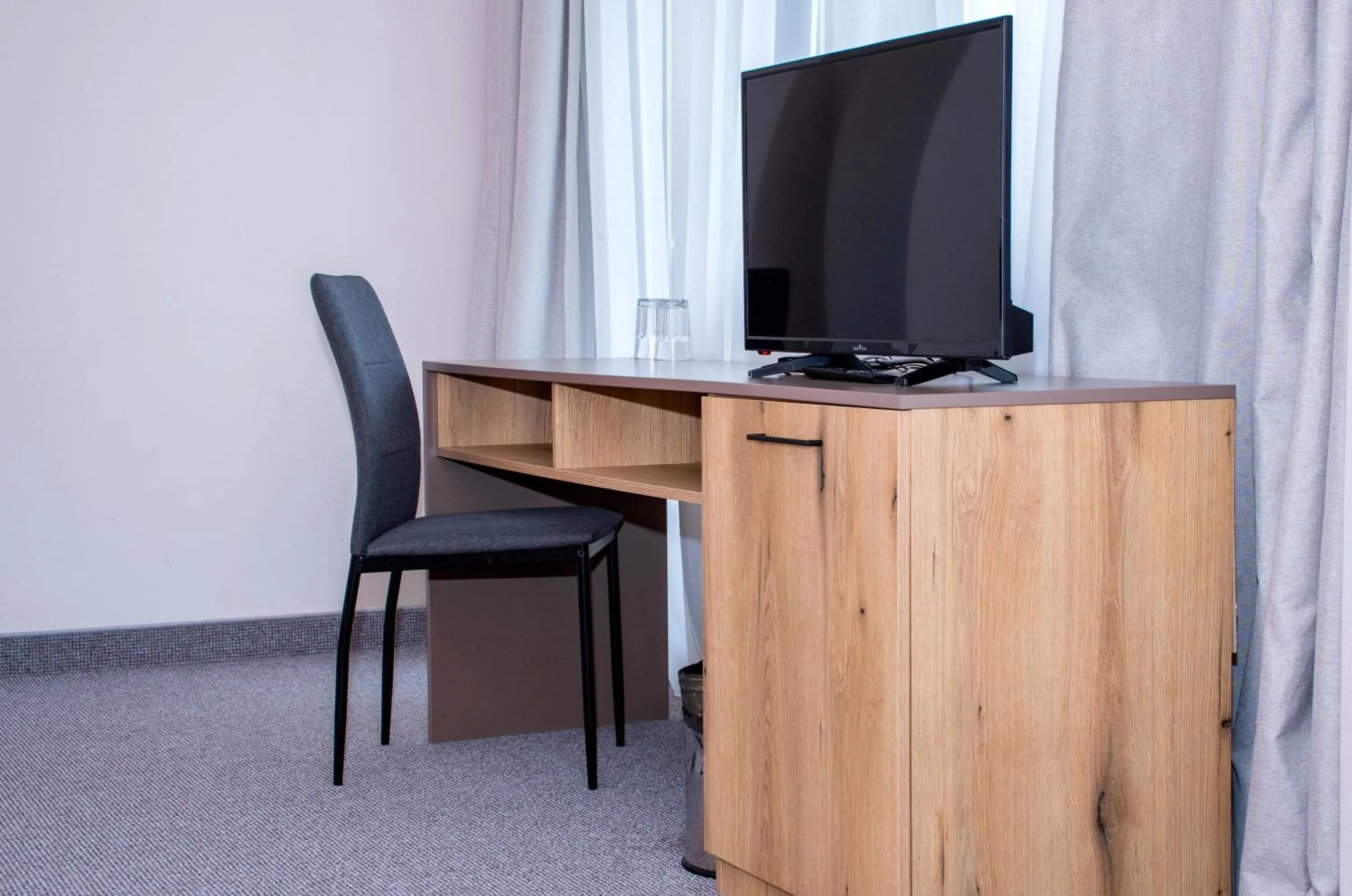 Communal lounge/ TV room in Hotel Orphey