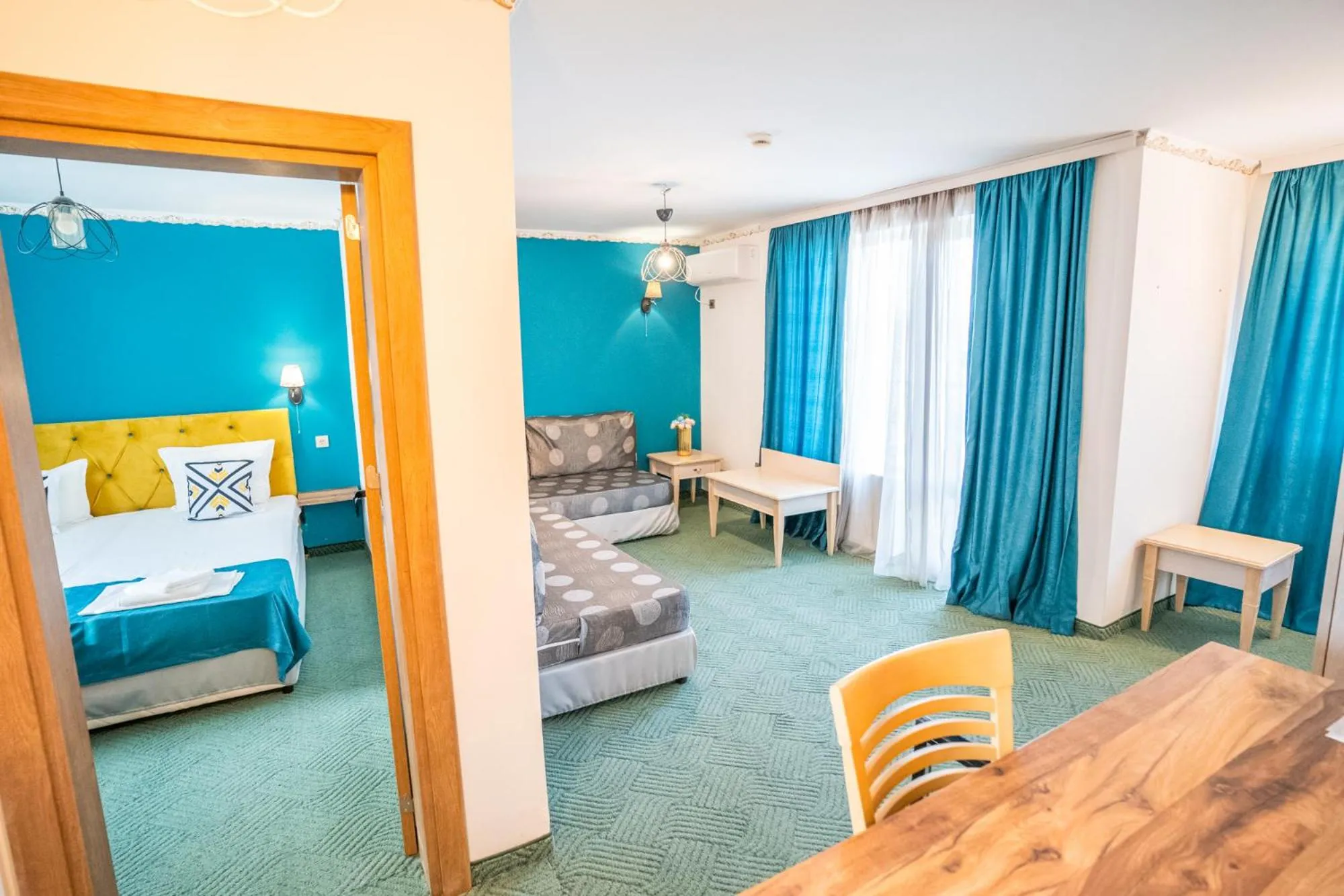 Living room, Bed in Royal Calisto Hotel